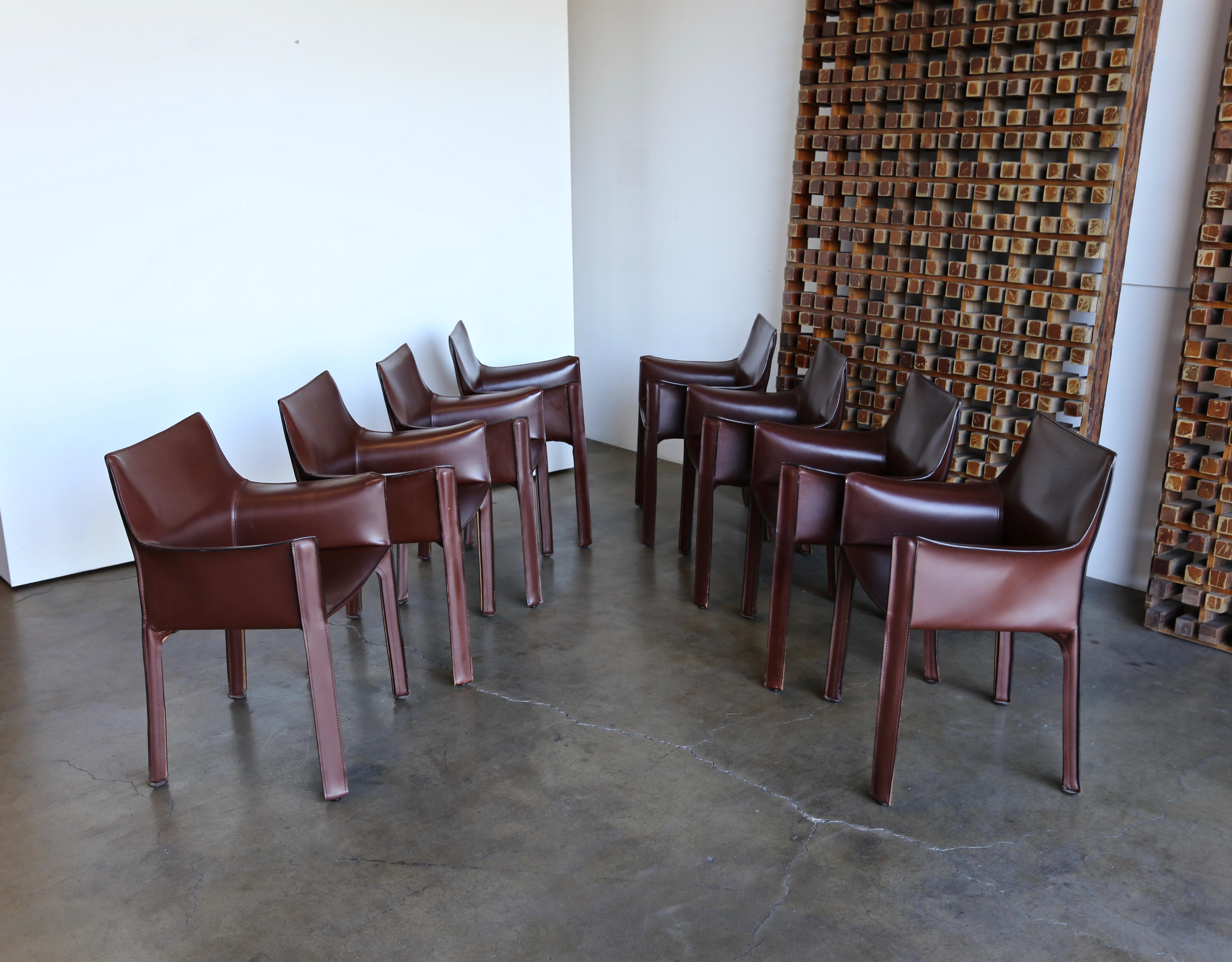 Set of eight brown leather CAB chairs by Mario Bellini for Cassina.