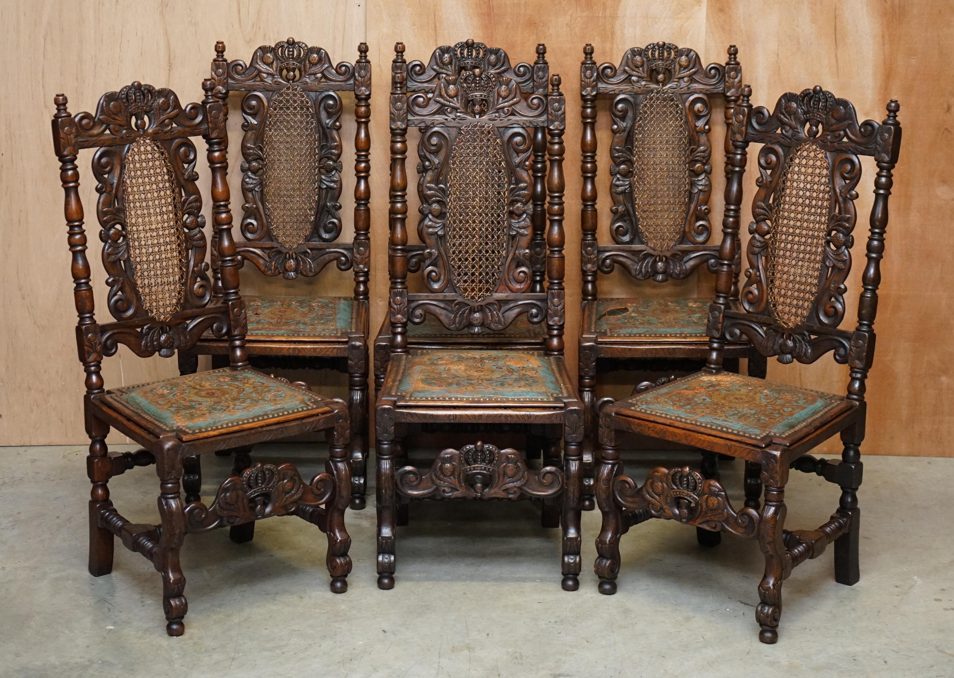 We are delighted to offer for sale this very rare suite of mid Victorian throne dining chairs based on early Jacobean designs with hand painted leather embossed seats with bergere rattan bases. 

These are pretty much the finest examples of this