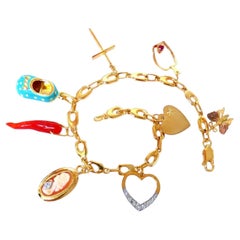 Eight Charms Link Bracelet 14kt gold 7.5 inch 14gm*