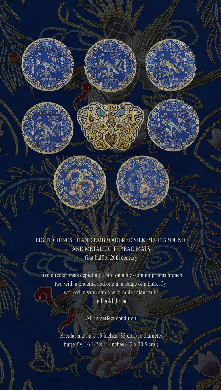 Eight Chinese hand embroidered silk blue ground
and metallic thread mats
First half of 20th century.

Five circular mats depicting a bird on a blossoming prunus branch
two with a phoenix and one in a shape of a butterfly
worked in satin stitch