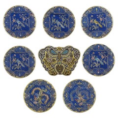 Otto tappetini cinesi ricamati a mano in seta con fondo blu e filo metallico