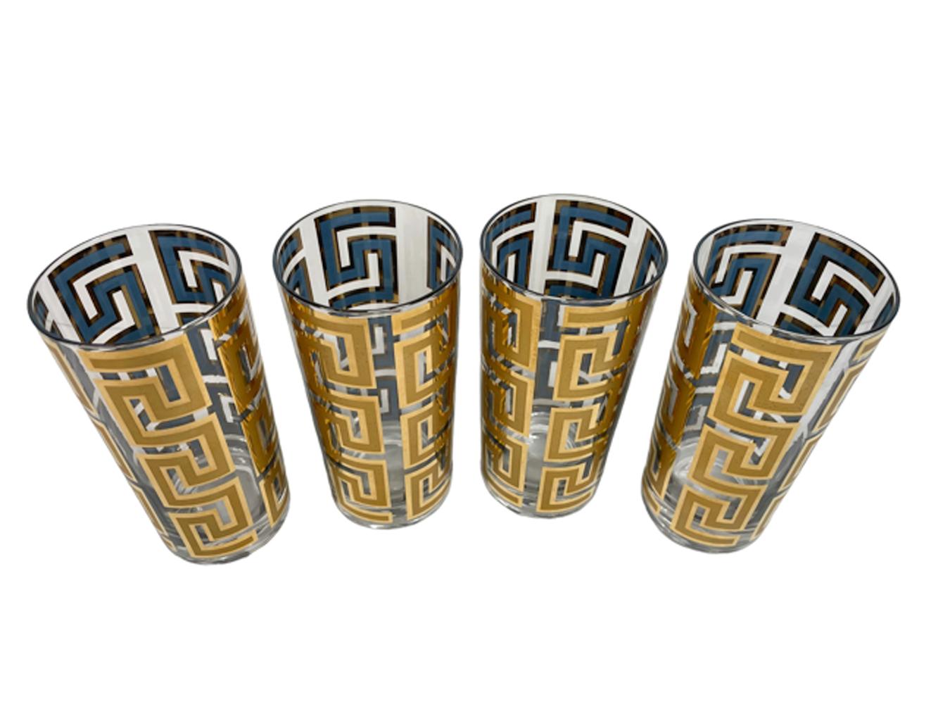 Eight Culver, LTD. highball glasses with vertical Greek Key bands of 22k gold over blue enamel. The gold with satin finish within gloss on the exterior with the blue visible only on the interior with gold border.