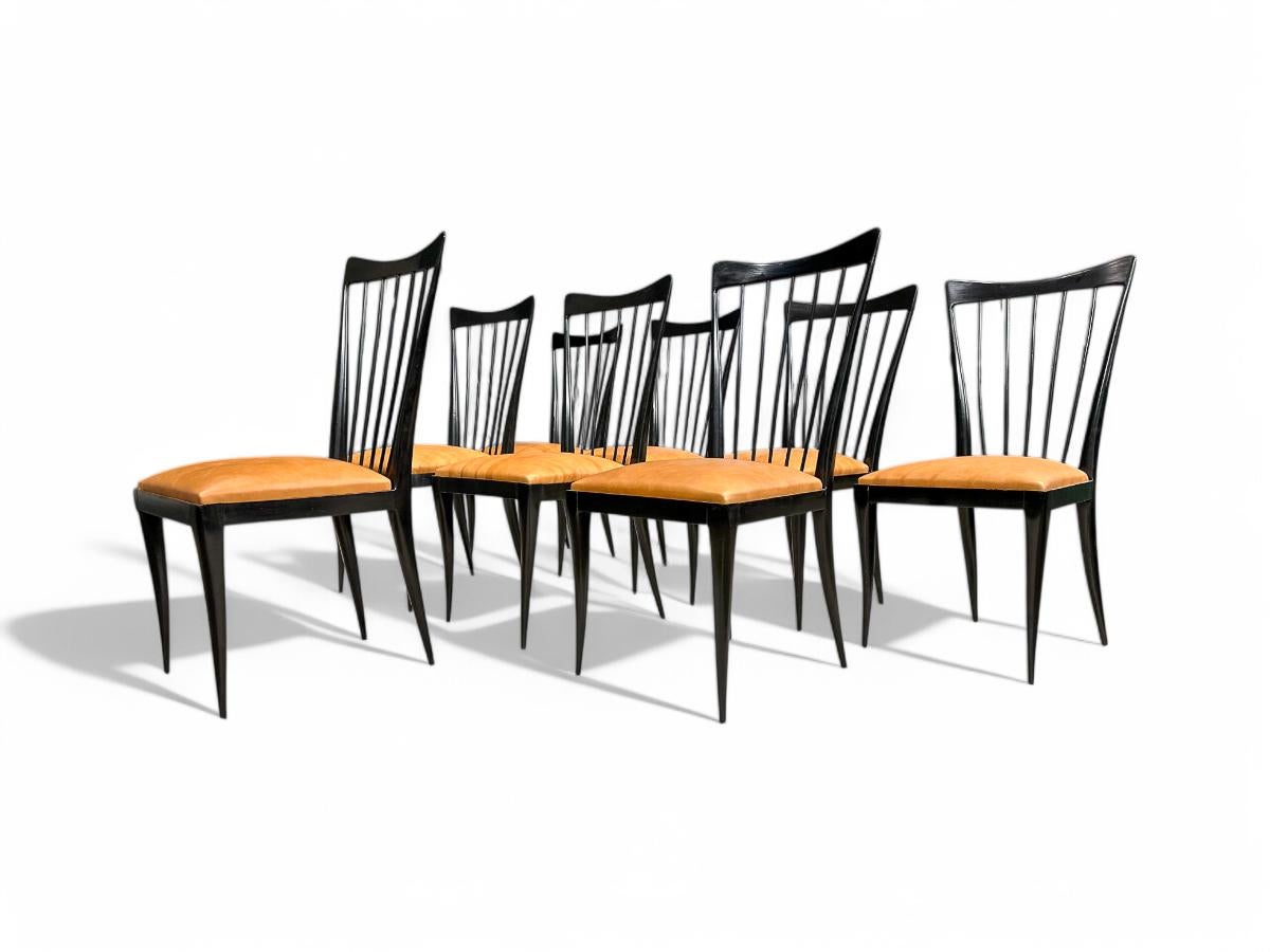 Available today, this set is nothing less than spectacular!

This set of eight dining chairs was designed by Giuseppe Scapinelli in the 1950s. The structure of the chairs is in hardwood with an ebony finish. The sculpted back and legs are typical of
