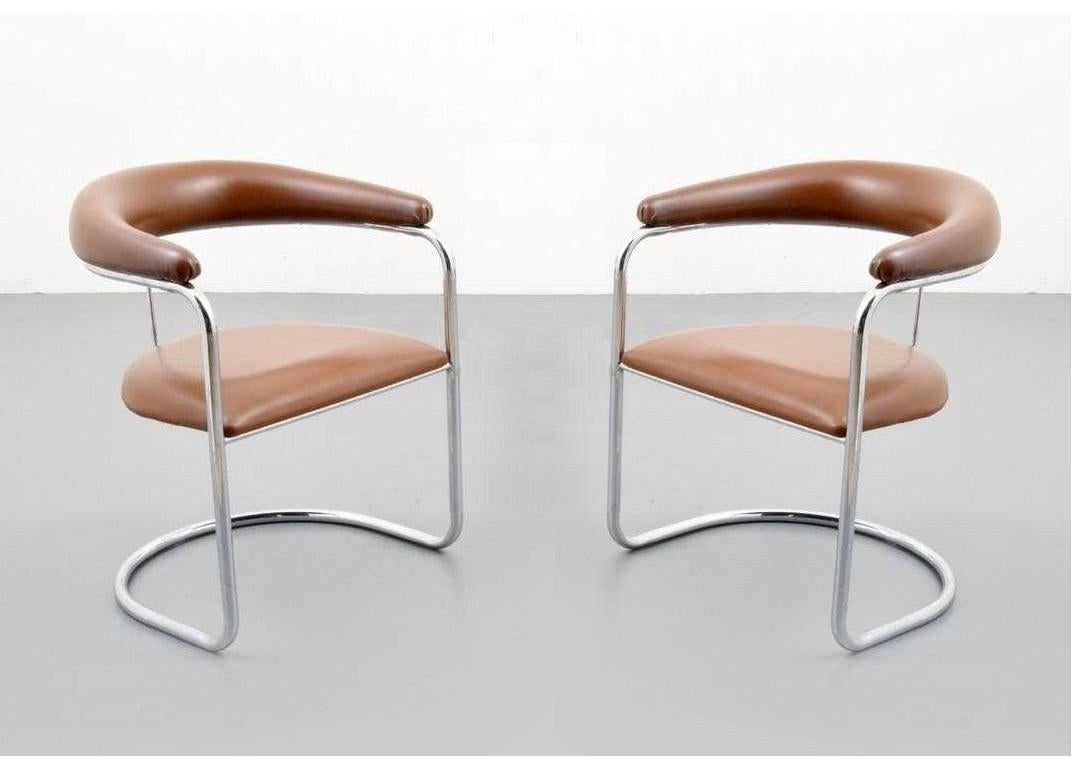 Set of 8 armchairs designed by Anton Lorenz for Thonet. Each chair has tan upholstered backrest and seat with polished chrome tubular frames.

Mid-Century Modern S-37 chairs were originally designed by Anton Lorenz in 1929 and later manufactured by