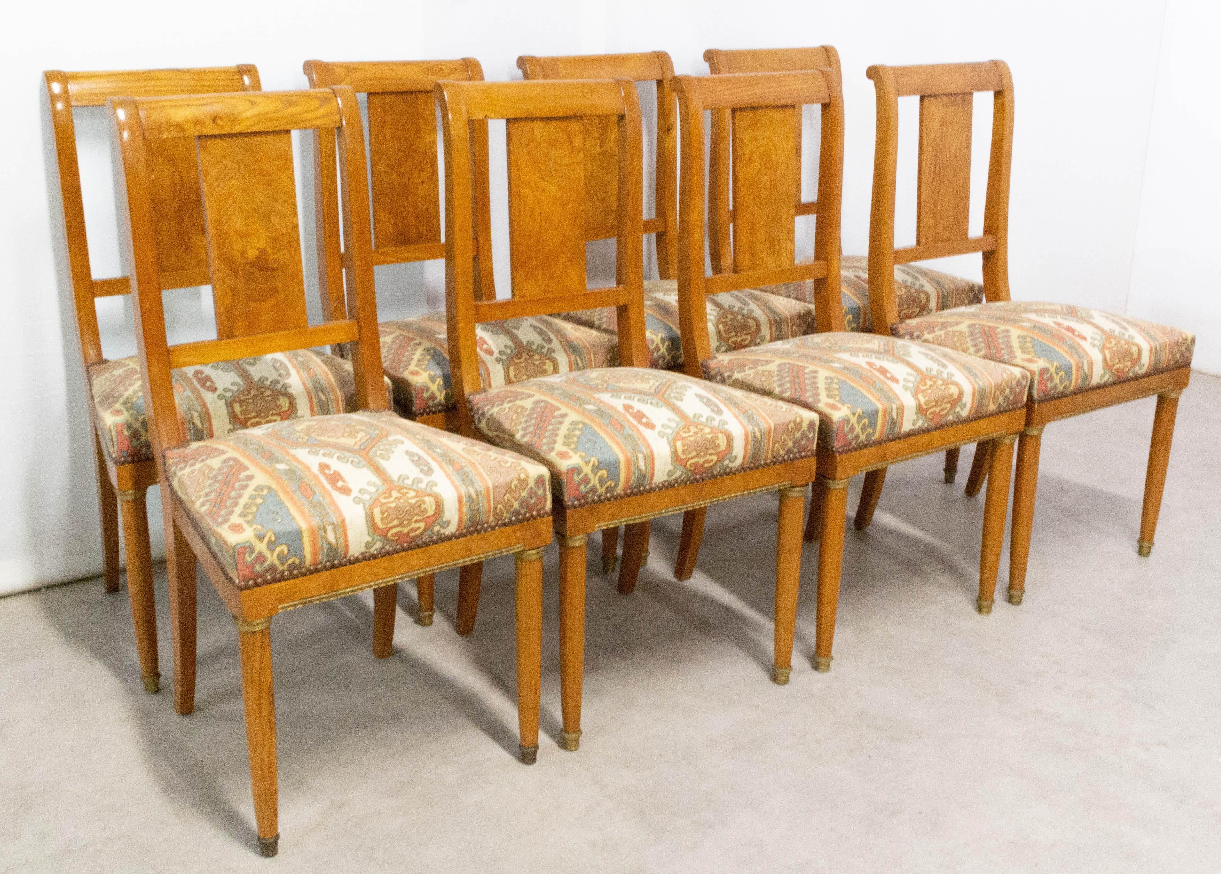 Set of eight French dining chairs circa 1920 
Empire style, solid elm and elm burr
They can be recovered to suit your interior.
In very good condition, solid and sound.

Shipping:
4 packs: 45/62/94 cm 16 kg.
  