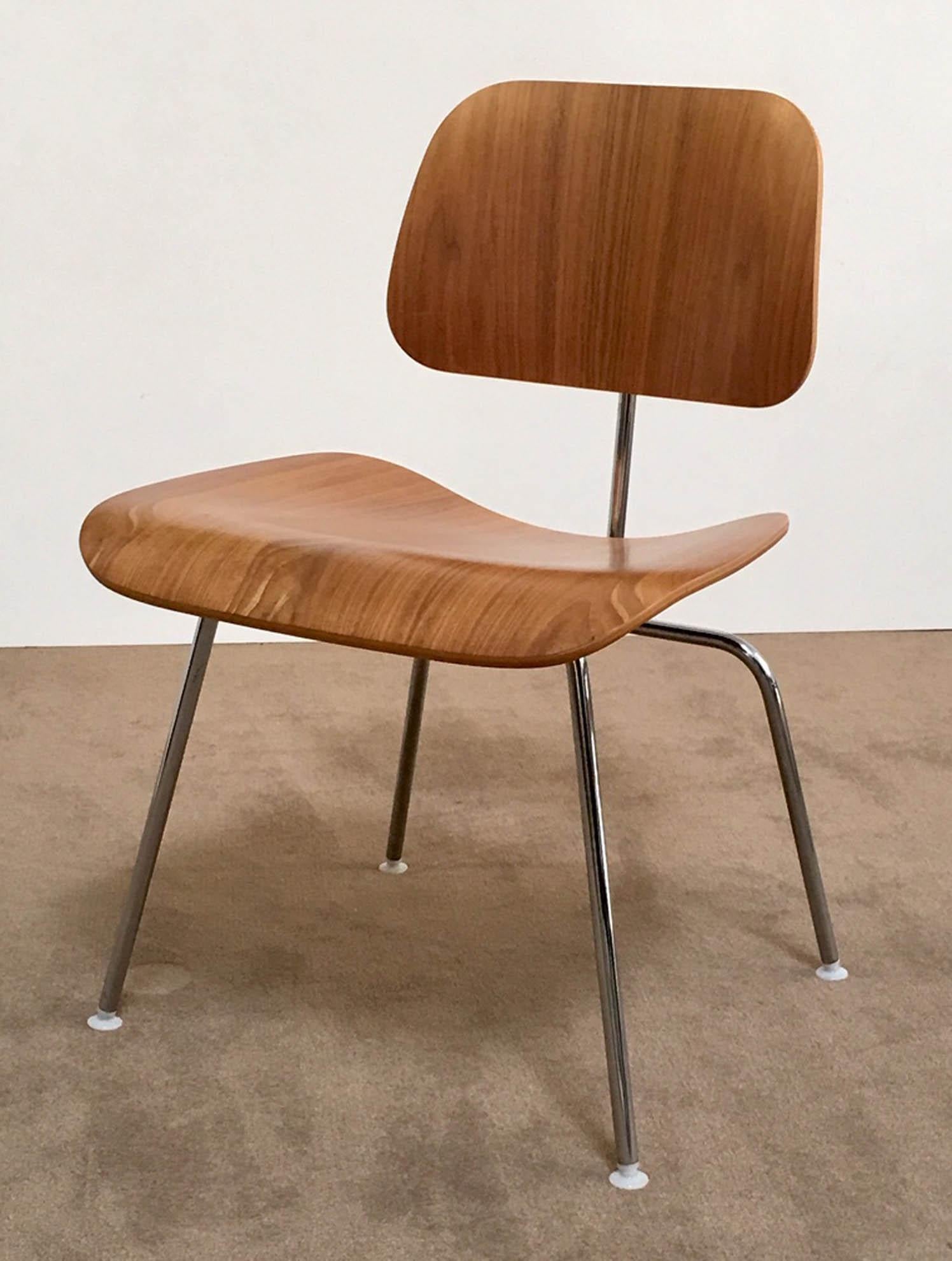 Set of 8 (DCM) dining chairs designed by Ray and Charles Eames for Herman Miller. Original labels intact (see photo)) Molded plywood, rubber mounts, metal legs, plastic feet. This is an upright chair perfect for dining. Sold as a set. Price is for