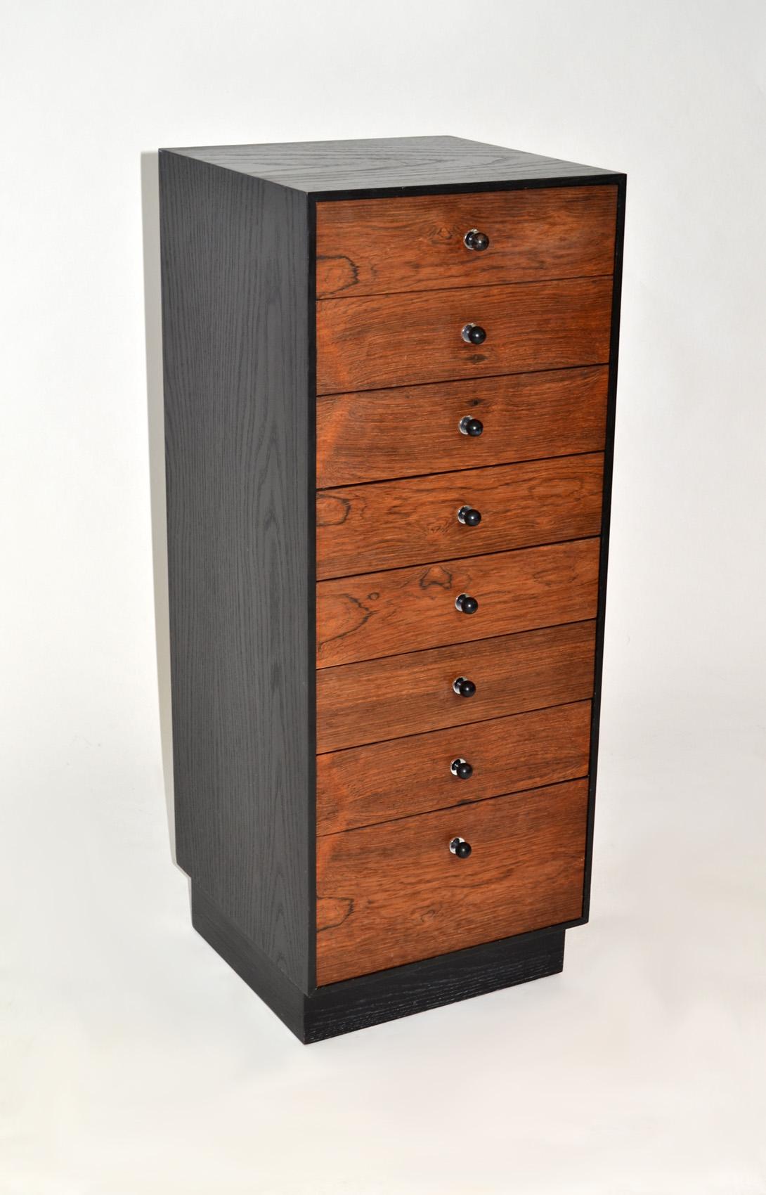 Eight drawer chest of drawers or jewelry chest in rosewood by Harvey Probber.

Jewelry, lingerie, silver or chest or drawers with eight drawers, rosewood fronts, ebonized oak sides and back with chrome plated metal, and black enameled metal pulls.