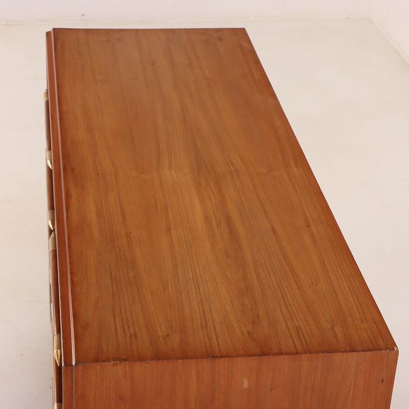 Brass Eight drawer dresser with elongated wood and brass handles For Sale