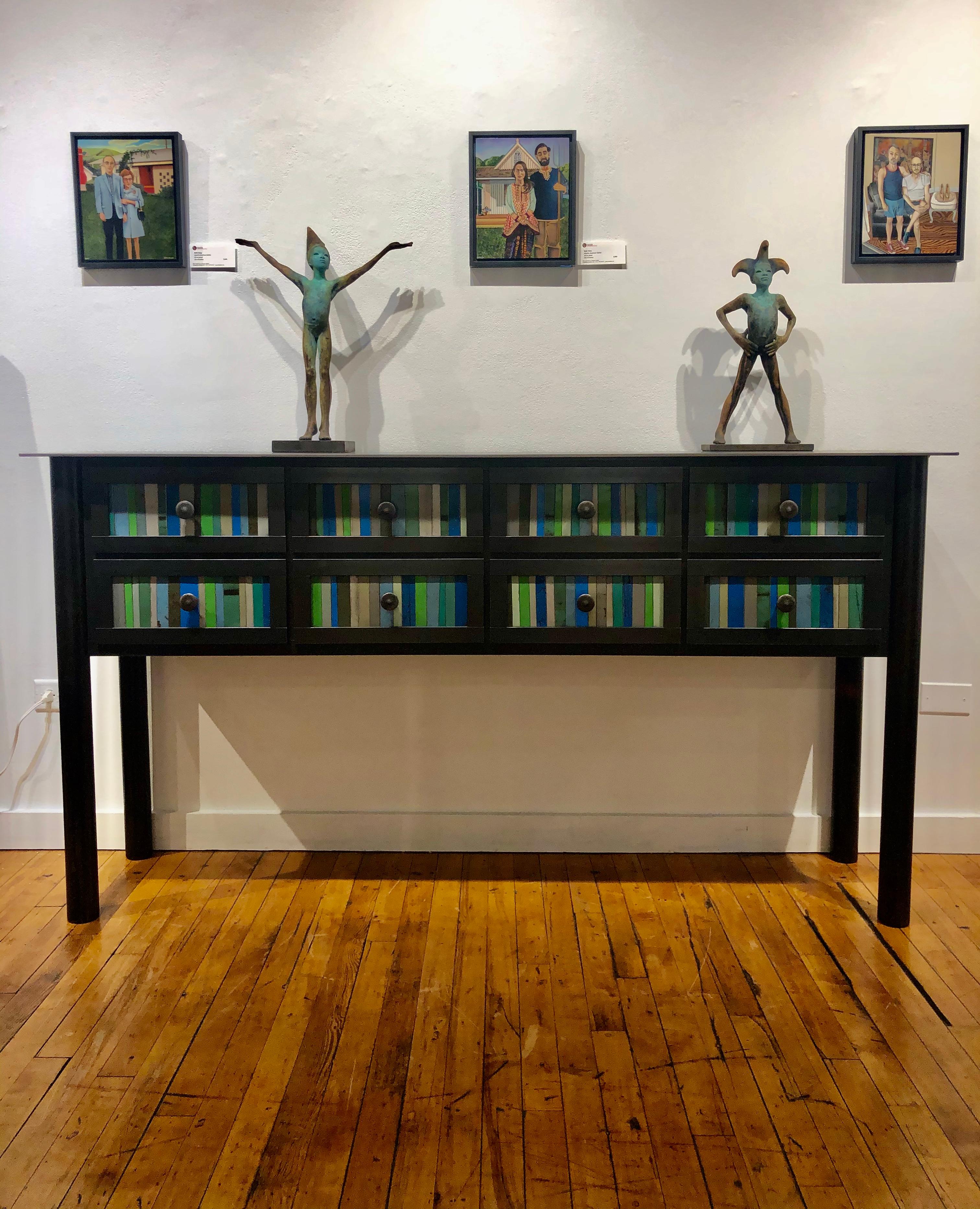 This modern 8-drawer counter is made from hot roll blue steel with the front panel design based on the Gees Bend Quilts. Each panel is unique with the use of galvanized rusted steel that is salvaged. Its rich grey, blue and green tones enhance the