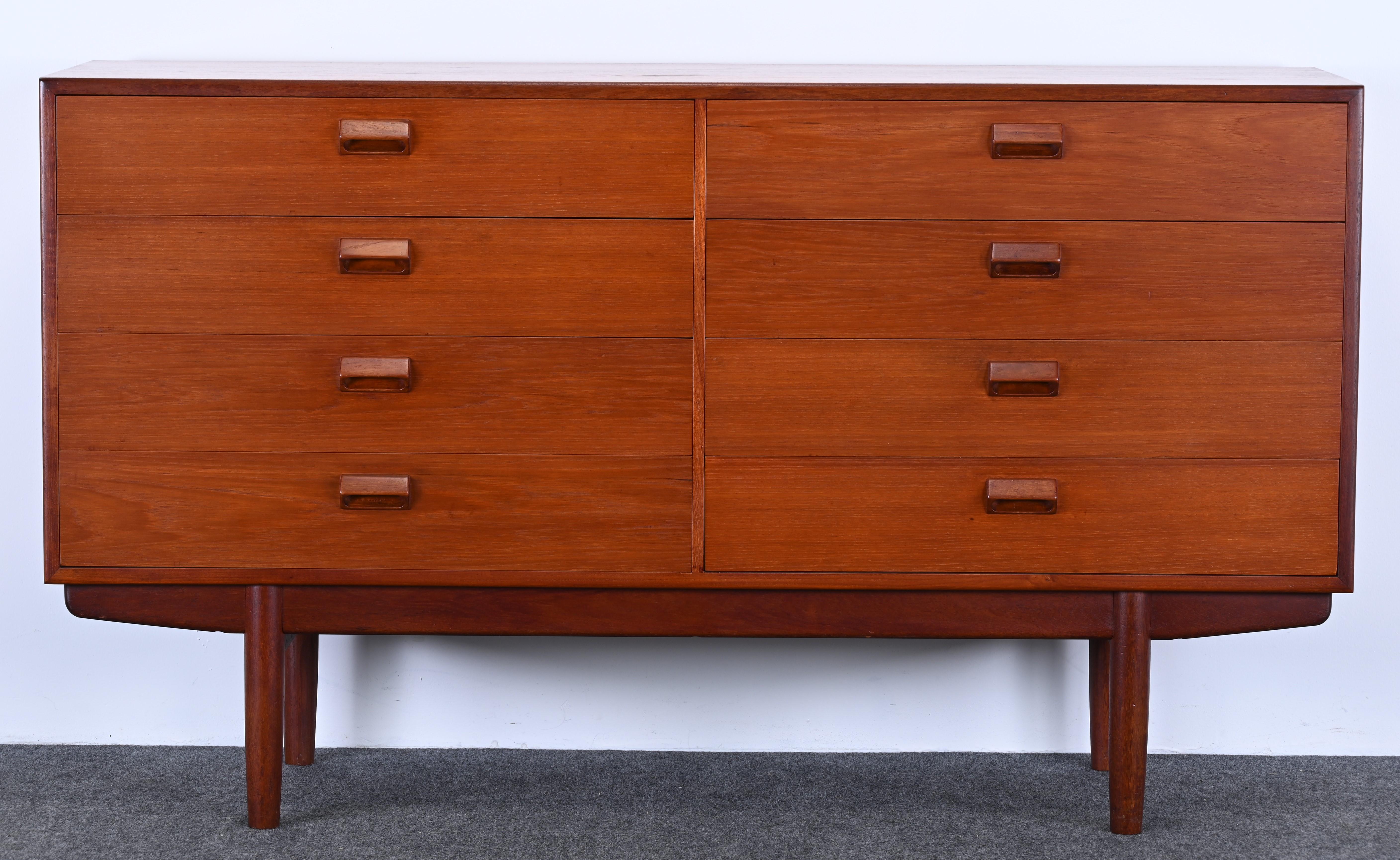 A Mid-Century Modern eight-drawer chest or dresser in teak by Borge Mogensen. This is a great simple line design cabinet that would work great in any interior. Structurally sound and in good condition with age-appropriate wear. Labeled 