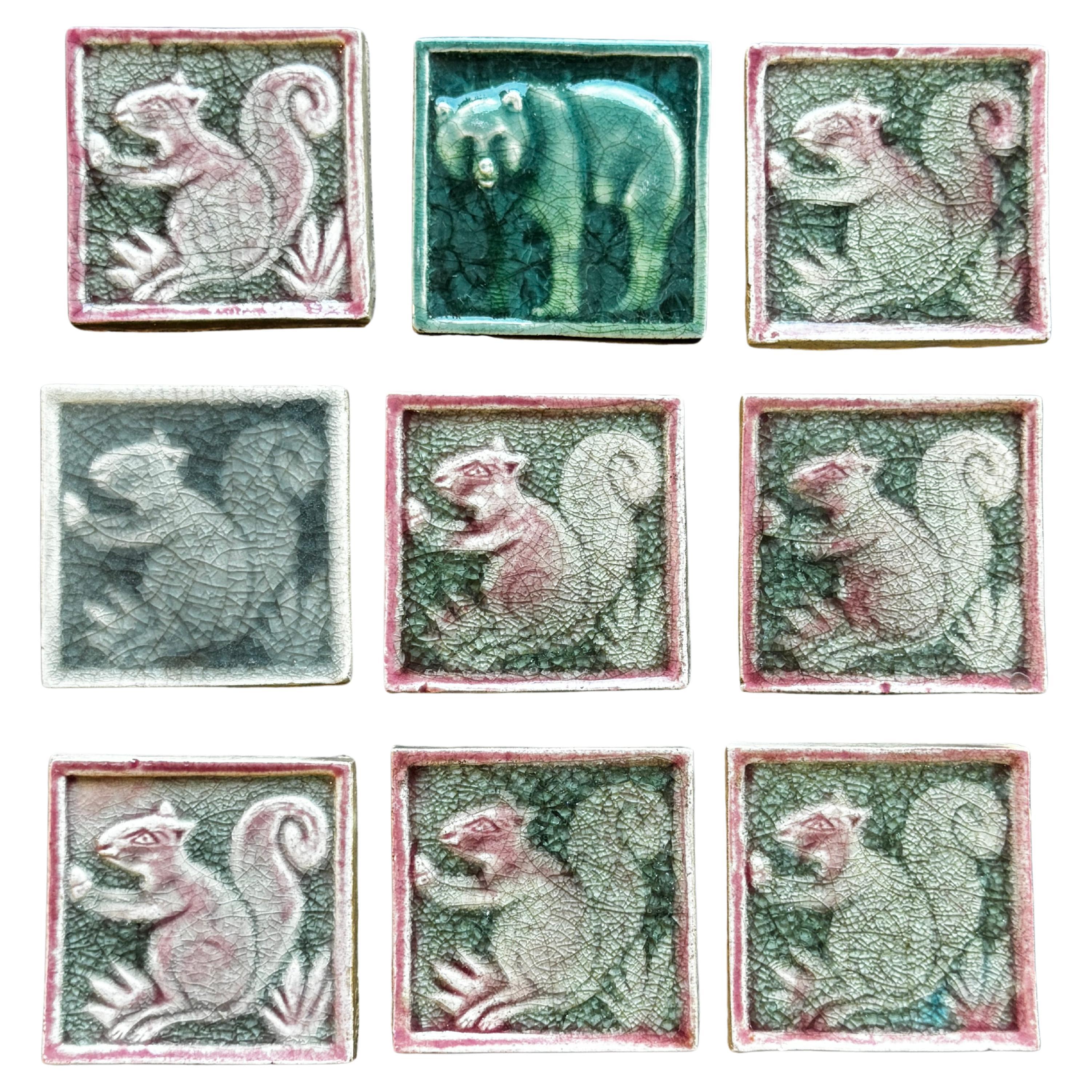 Nine Early 20th Century Glazed Tiles of Squirrels and Bear For Sale
