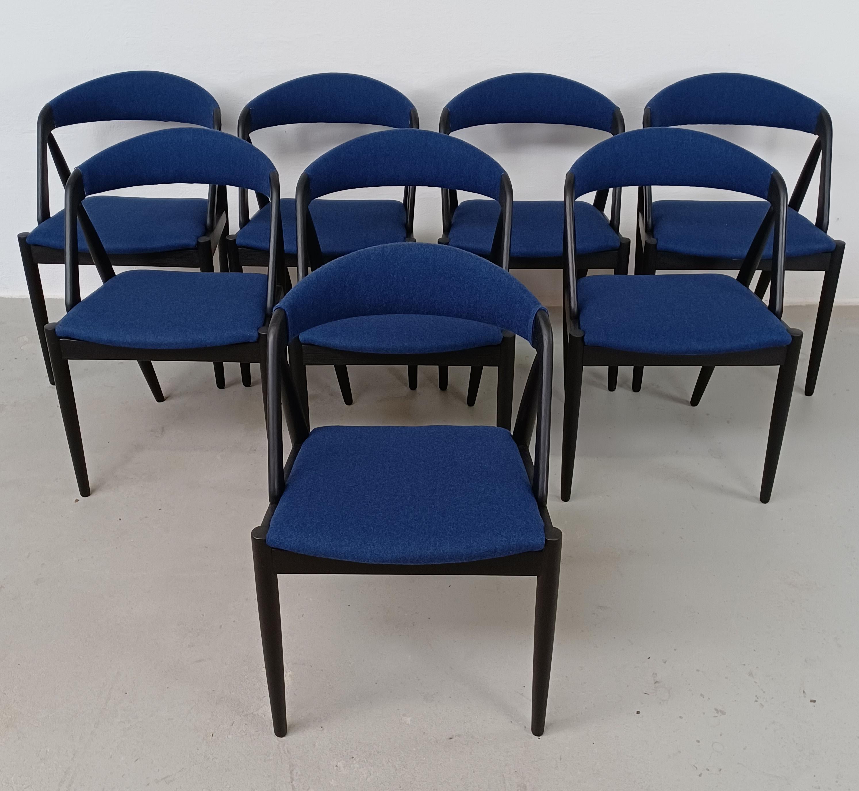 Set of eight ebonized customizable Kai Kristiansen dining chairs in excellent condition.  

The chairs have been fully restored by our skilled cabinetmakers - all joints checked and reglued under pressure if needed, frames sanded by hand 2 - 3 times