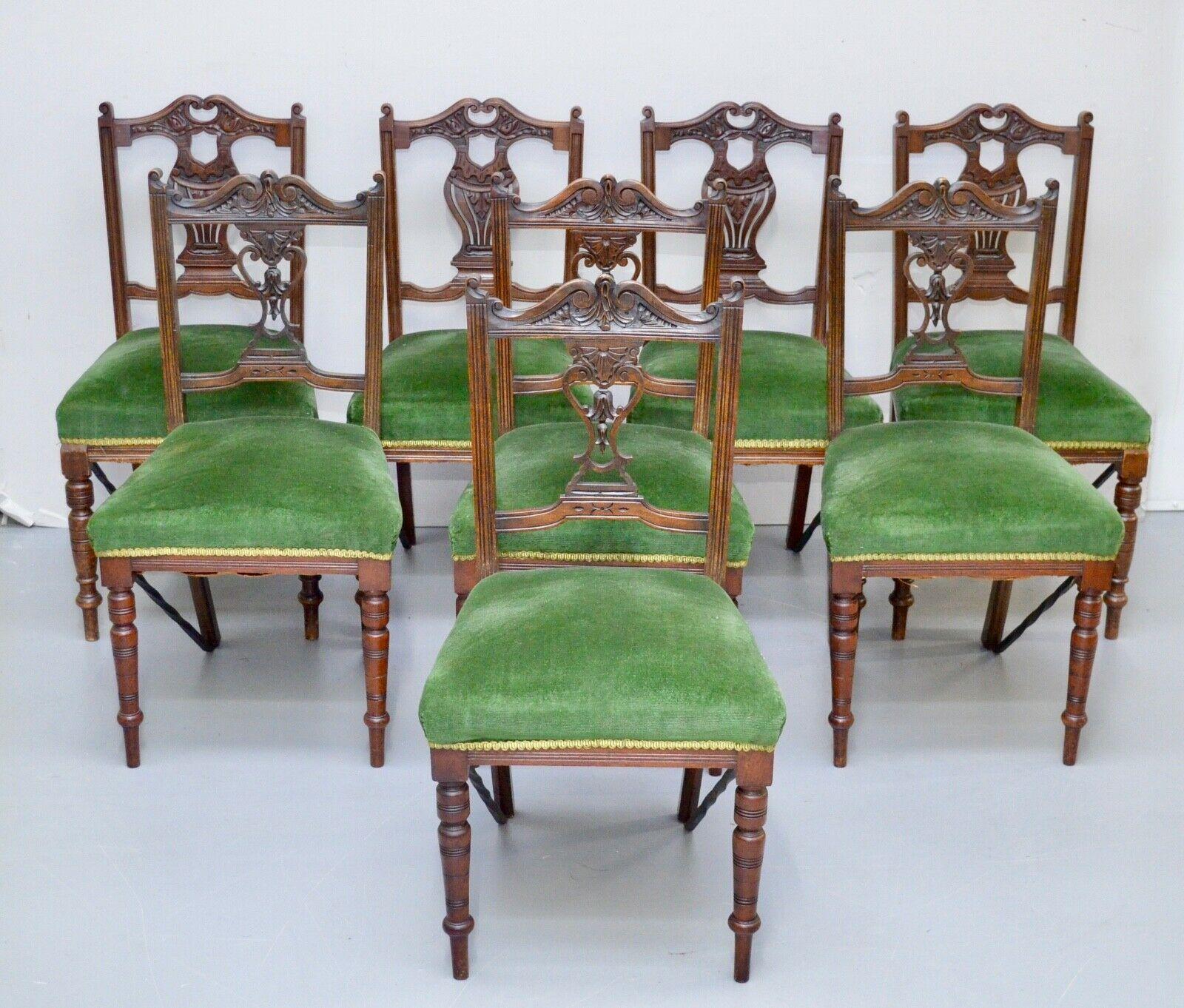 We are delighted to offer for sale this suite of eight Edwardian carved walnut dining chairs with pierced splat backs and upholstered in green velvet.
A beautiful set of solid chairs they all appear to be in good condition, they are fitted 
with