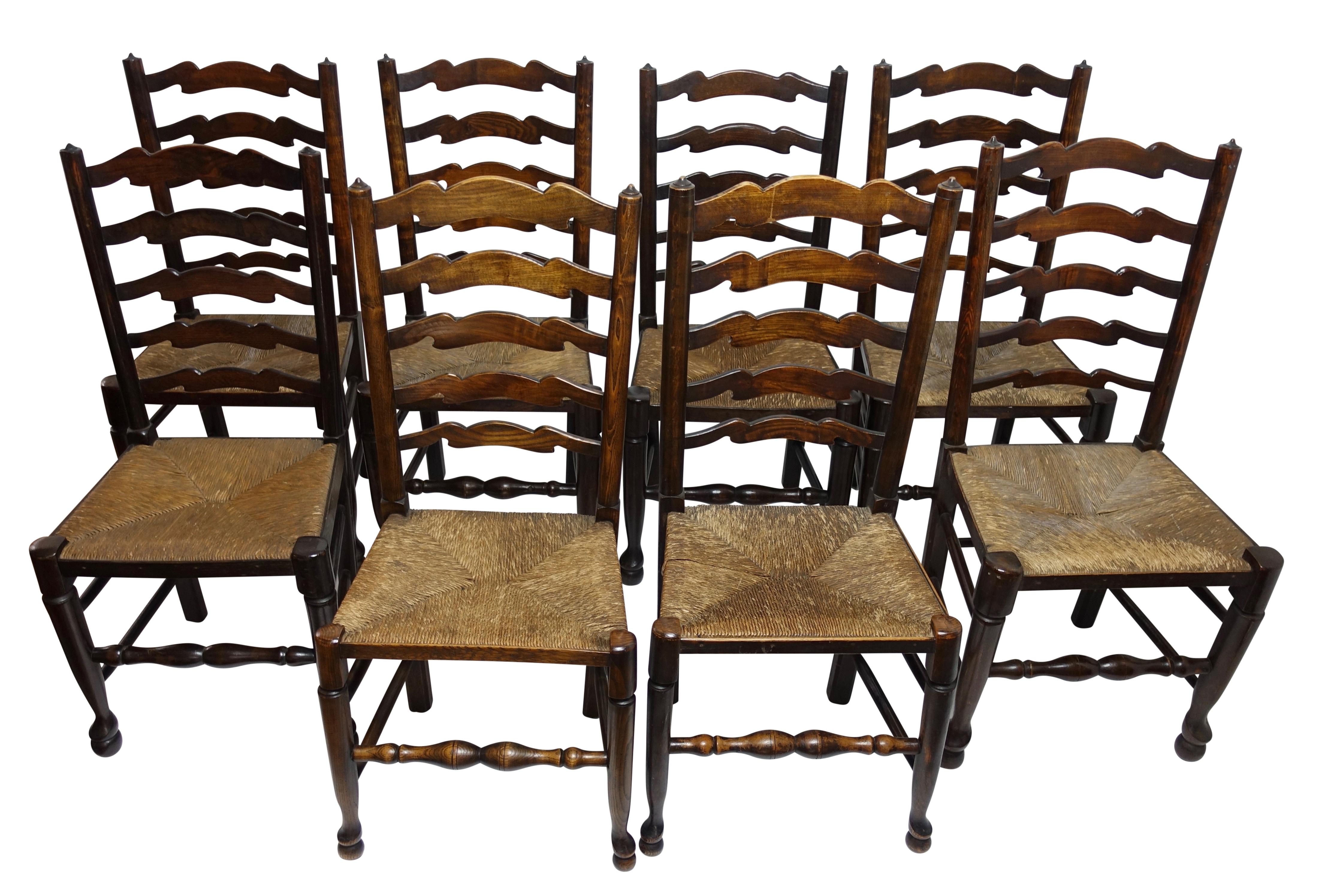 A very nice set of eight traditional style English Lancashire ladder back dining chairs with original rush seats. Hand crafted, sturdy, and with generous size seats. England, early 20th century.
There are six exact matches and two that have