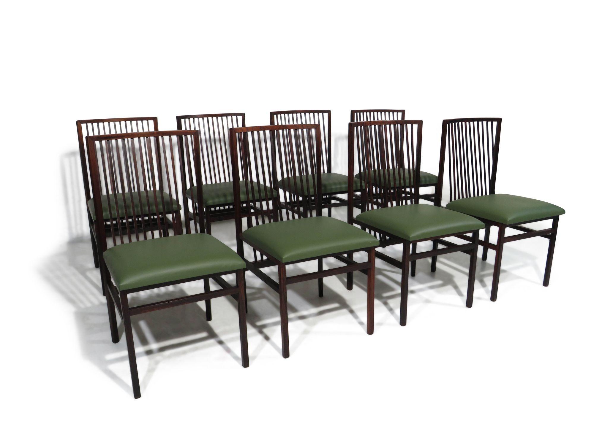 Set of eight dining chairs in the manner of Joaquim Tenreiro (1906-1992), Brazil, circa 1947. Handcrafted from solid jacaranda rosewood, these chairs feature architectural quadrangular rods, a curved back with mitered corners, and precisely joined