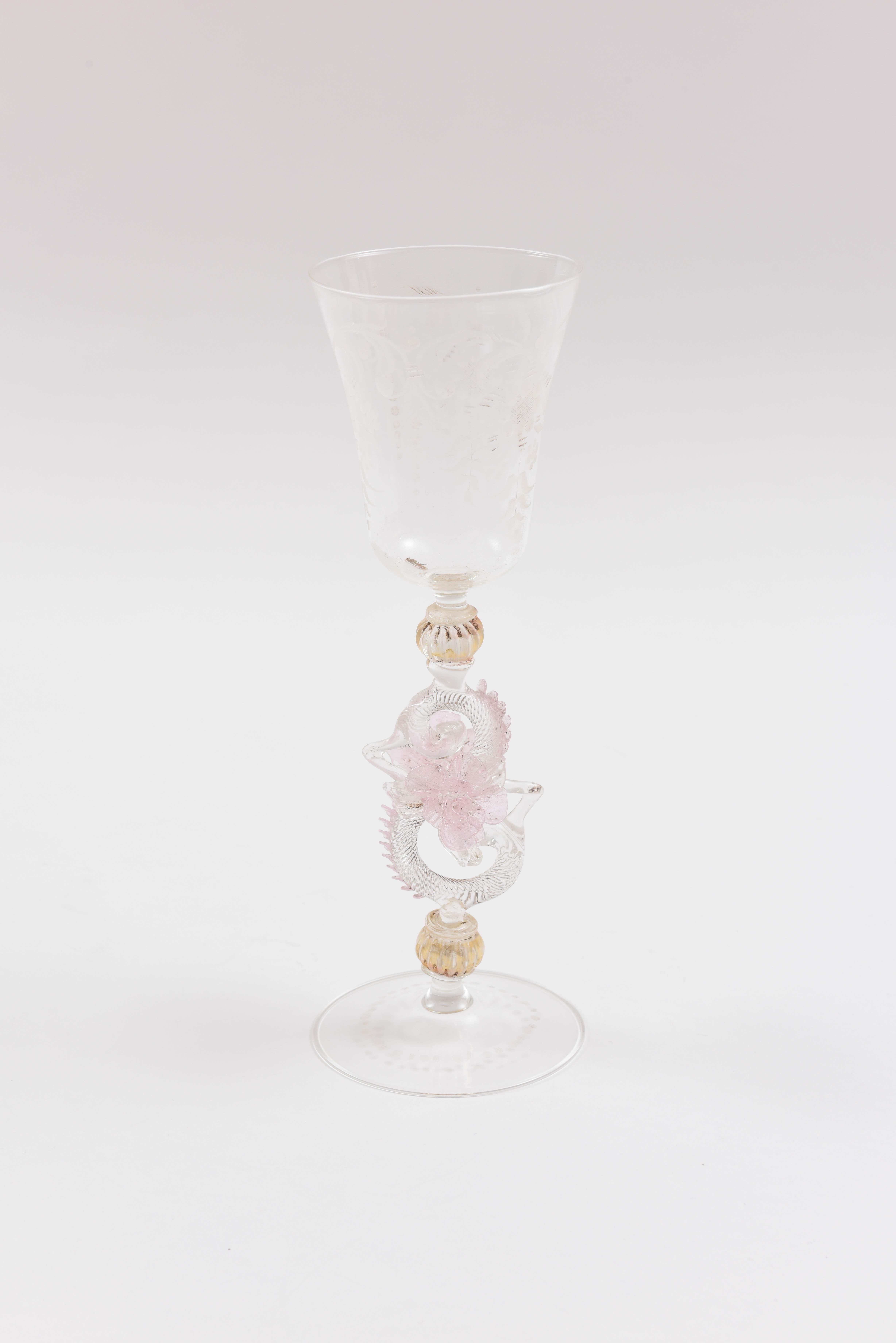A substantial set of eight very tall goblets from the Isle of Murano, Venice. These feature beautifully blown shapes and extra attention has been made to the applied floral decoration throughout. They also have a nice double blown ball stem and are