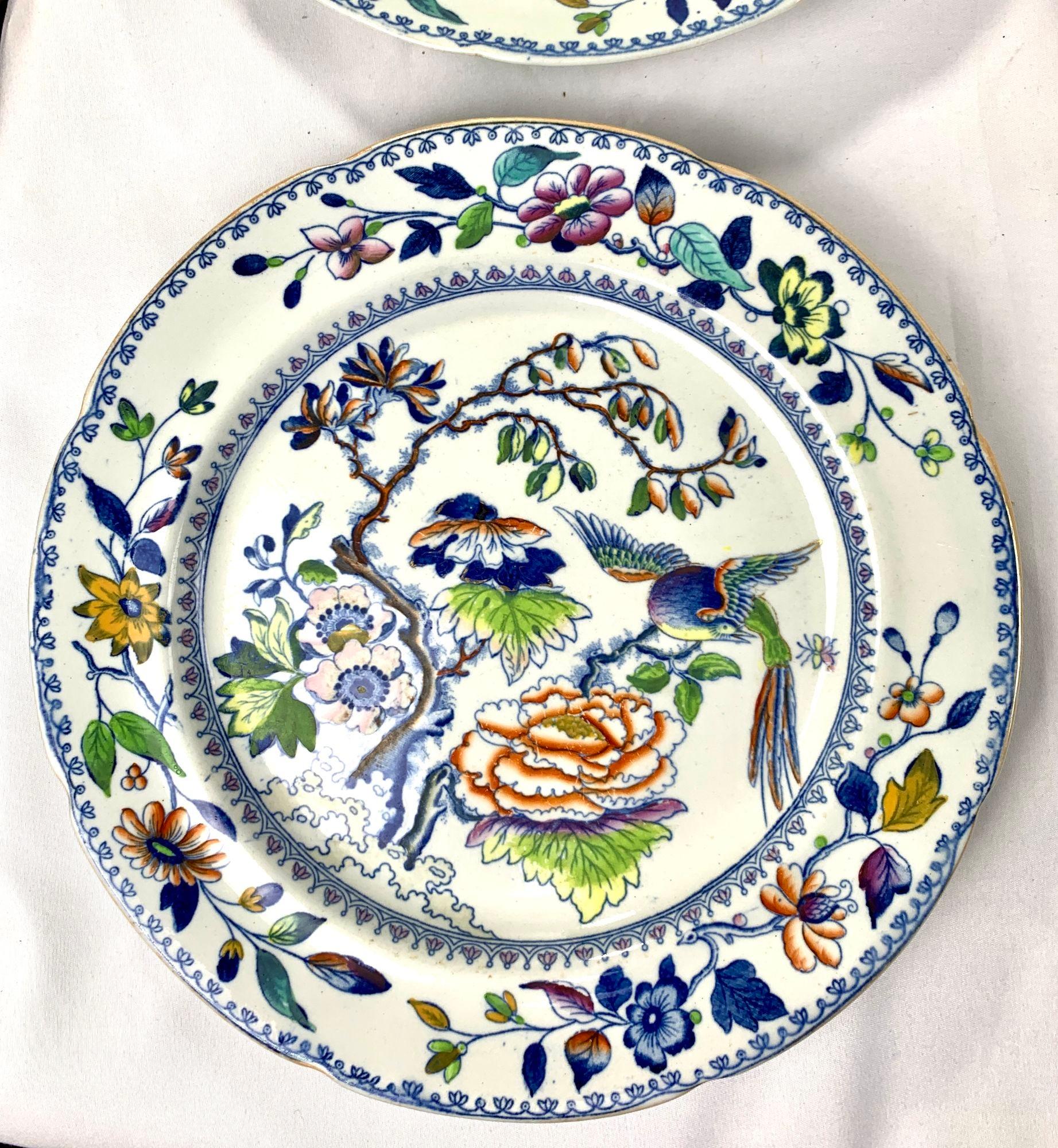 This set of eight Flying Bird plates has everything you want in a colorful pattern: a beautiful bird and flowers painted in rainbow colors.
The colors are an unexpected combination of purple, pink, yellow, orange, deep cobalt blue, and green.
The