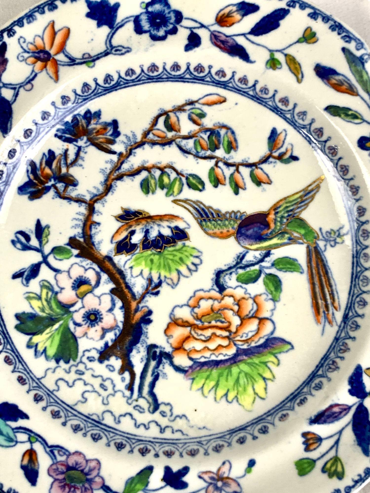 This set of eight Flying Bird dessert dishes has everything you want in a colorful pattern: a beautiful bird and flowers painted in rainbow colors.
The colors are an unexpected combination of purple, pink, yellow, orange, deep cobalt blue, and