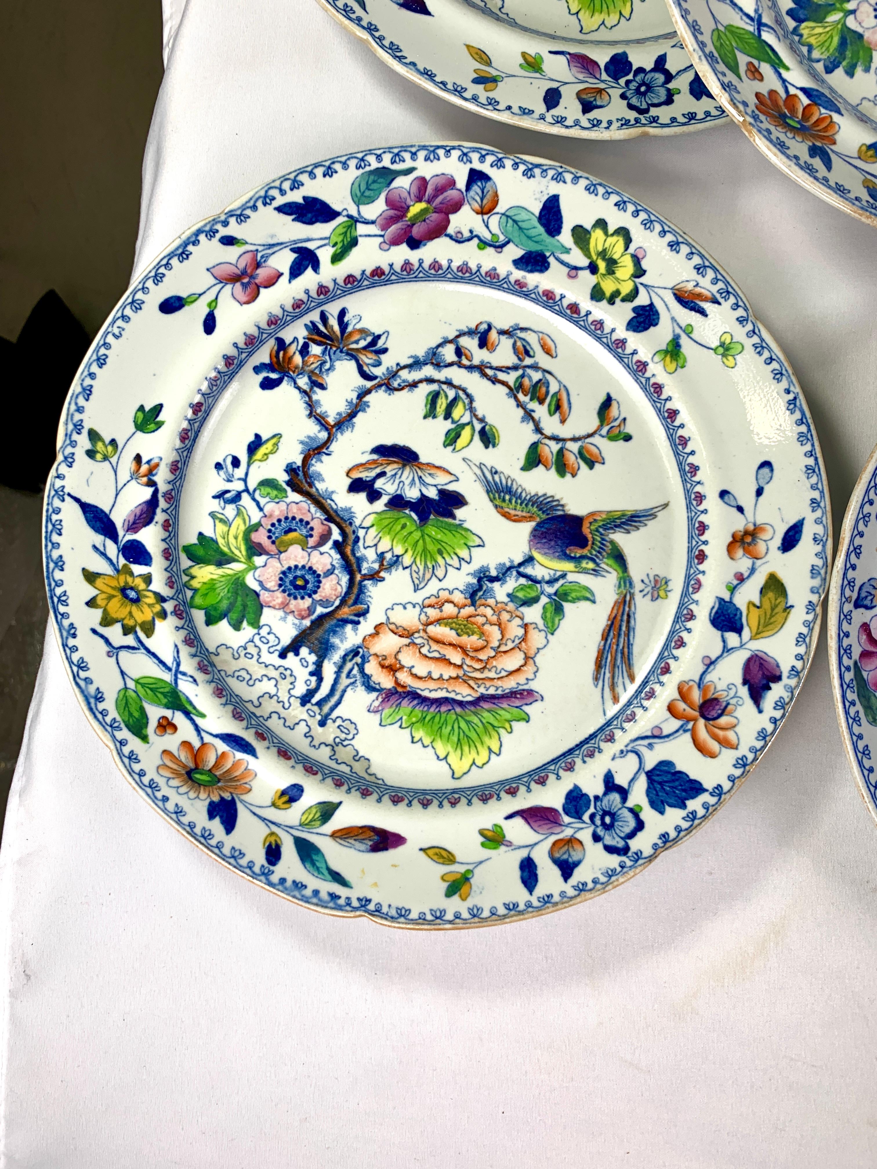 This set of eight Flying Bird dessert dishes has everything you want in a colorful pattern: a beautiful bird and flowers painted in rainbow colors.
The colors are an unexpected combination of purple, pink, yellow, orange, deep cobalt blue, and