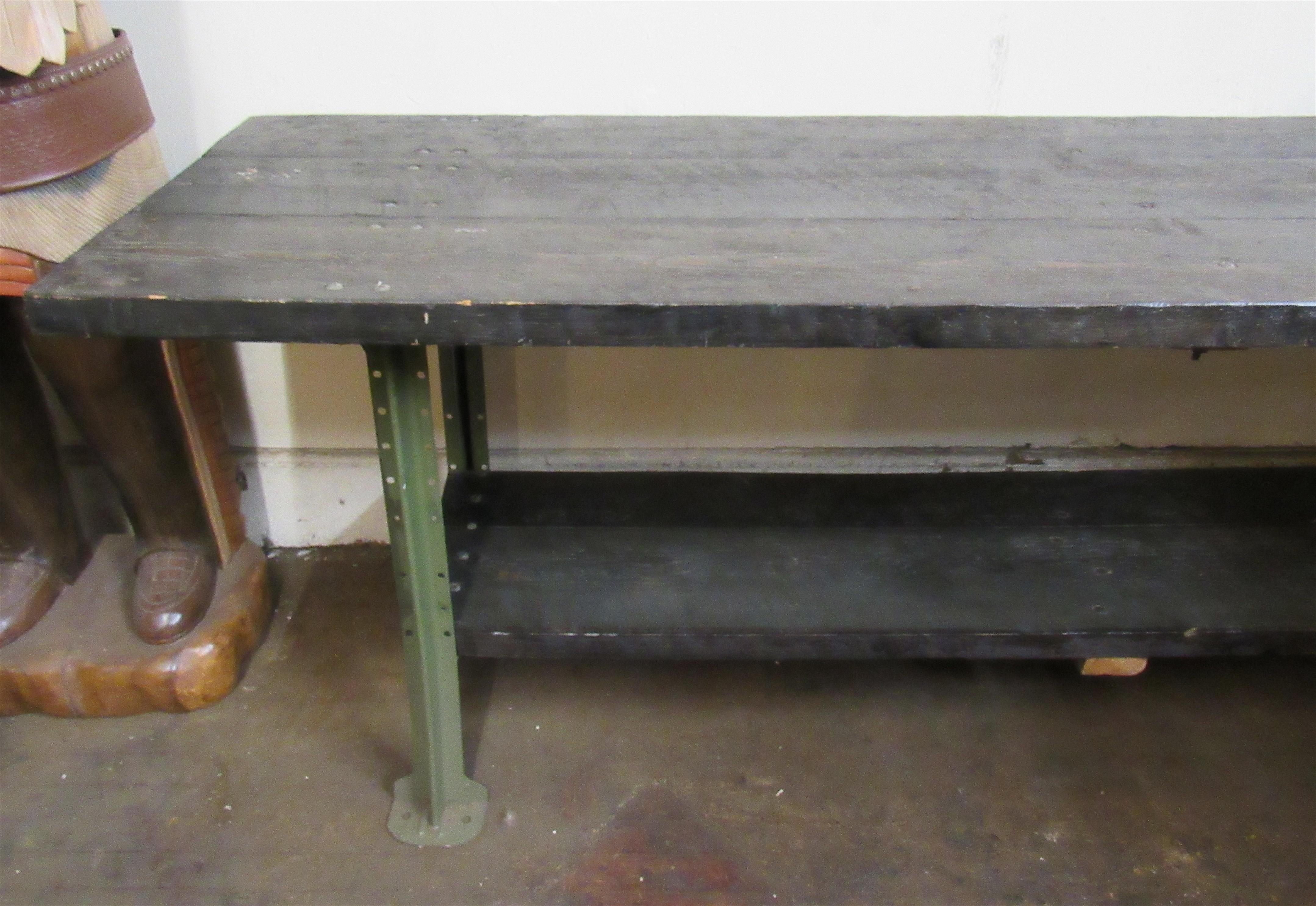 Eight foot long industrial workshop table with thick wood slabs on strong iron frame. Great for large kitchen use.
Please confirm location NY or NJ