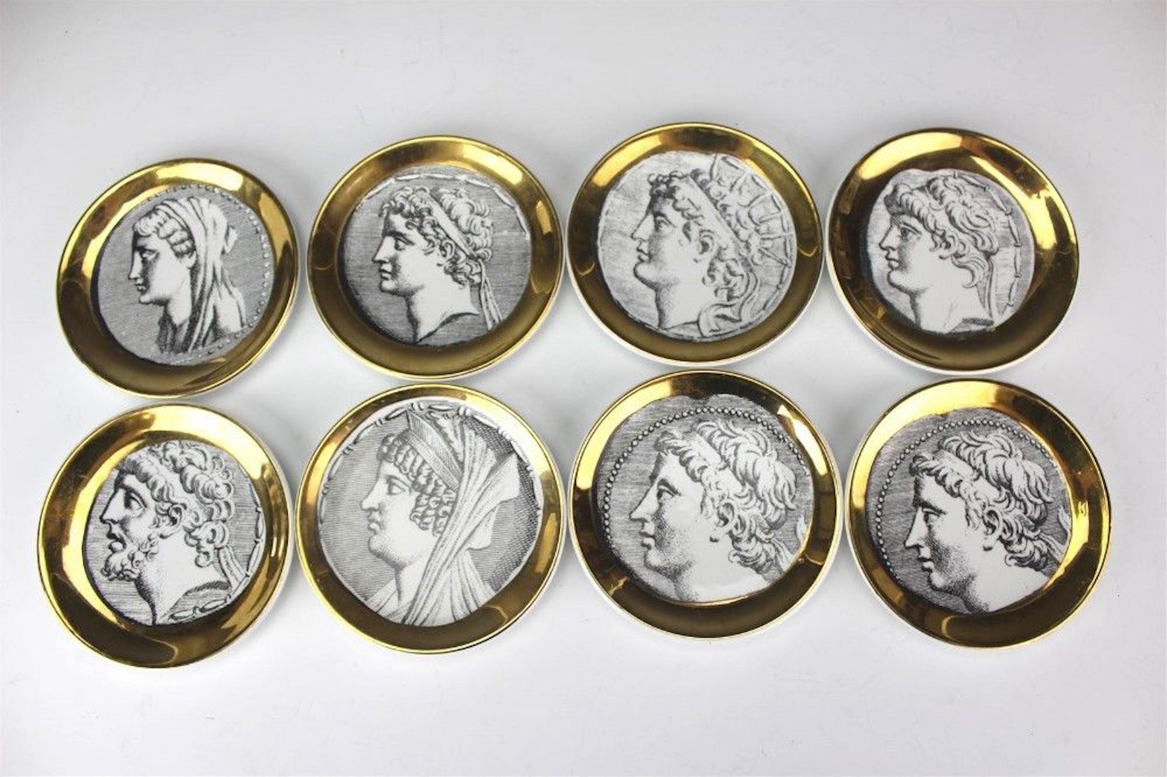 Eight Italian Mid-Century Modern Fornasetti Roman portrait coasters, each one with a different portrait head with gilt rims, signed Fornasetti Milano, Made In Italy, Monete. No chips, cracks or repairs. Each one has a 4