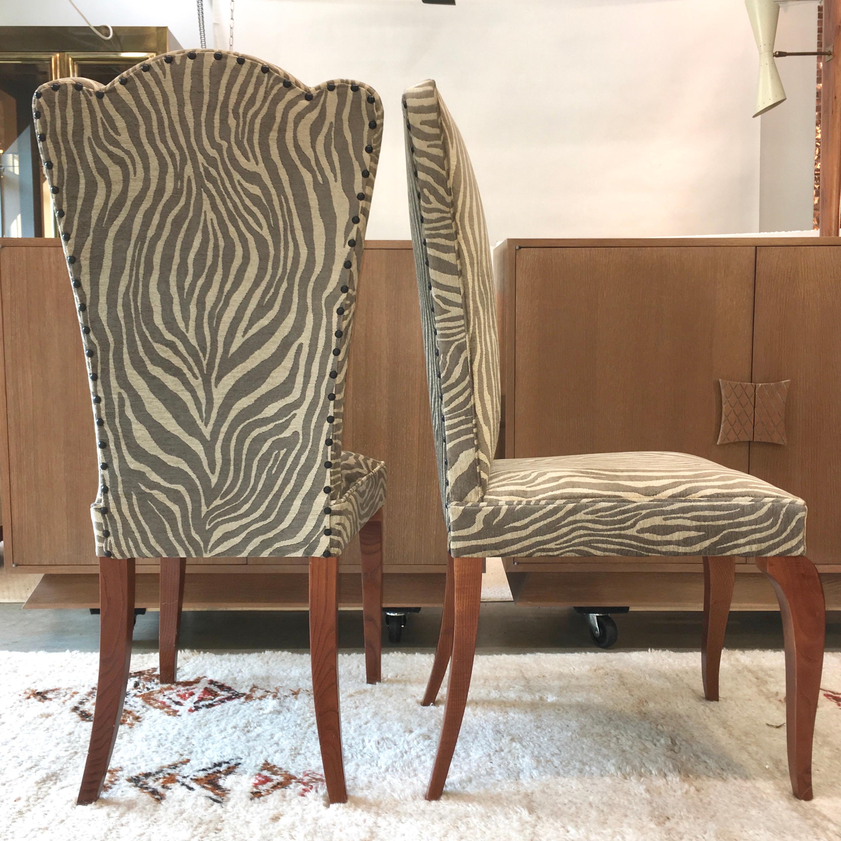 Set of eight (8) French 1940s ashwood side chairs, recently reupholstered in Holly Hunt fabric. Tied spring cushion seats. Tres chic silhouette: high heart-shaped back with tapered waist and distinctive French Art Deco Mini Mouse ears, saber rear