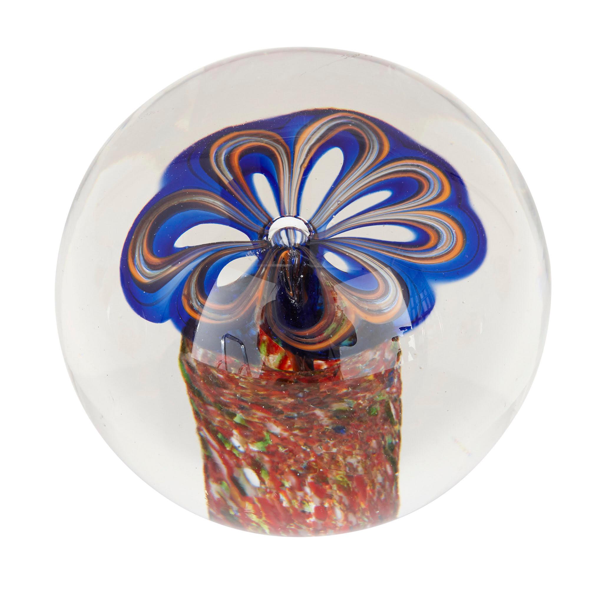 These beautiful paperweights were created in France in the 20th century. Glass paperweights began to be widely collected in the mid-19th century, after they were showcased at the International Exhibitions of the period. Paperweights like these are