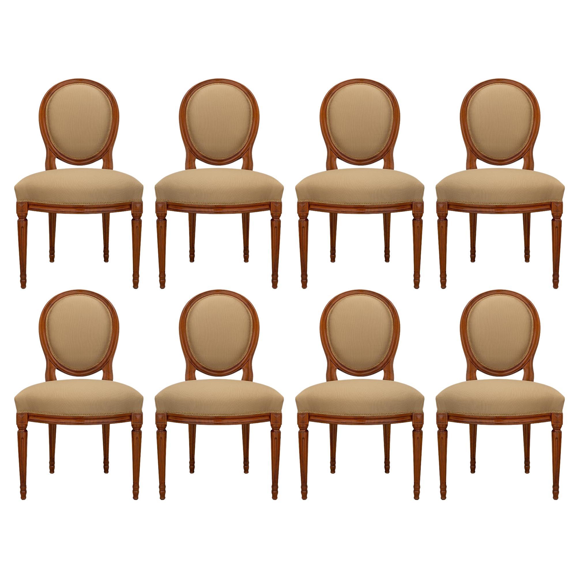 eight French turn of the century Louis XVI st. Walnut dining chairs For Sale