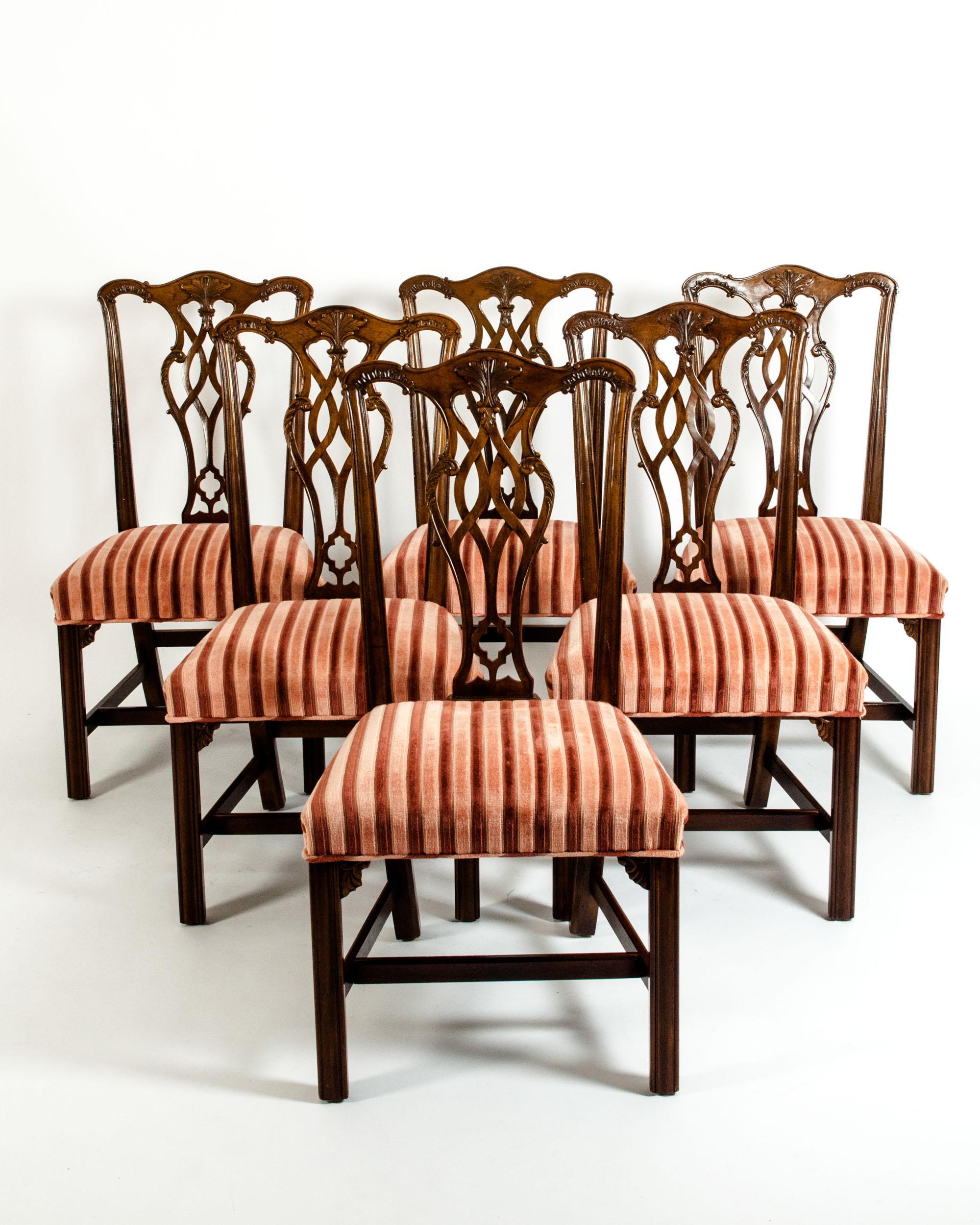 Set of eight Georges III style mahogany dining chairs . Six side chairs and two armchairs . Each chair is in excellent antique condition. Minor wear consistent with use / age . The side chair is about 39 inches H x 21 inches W x 17 inches D . The