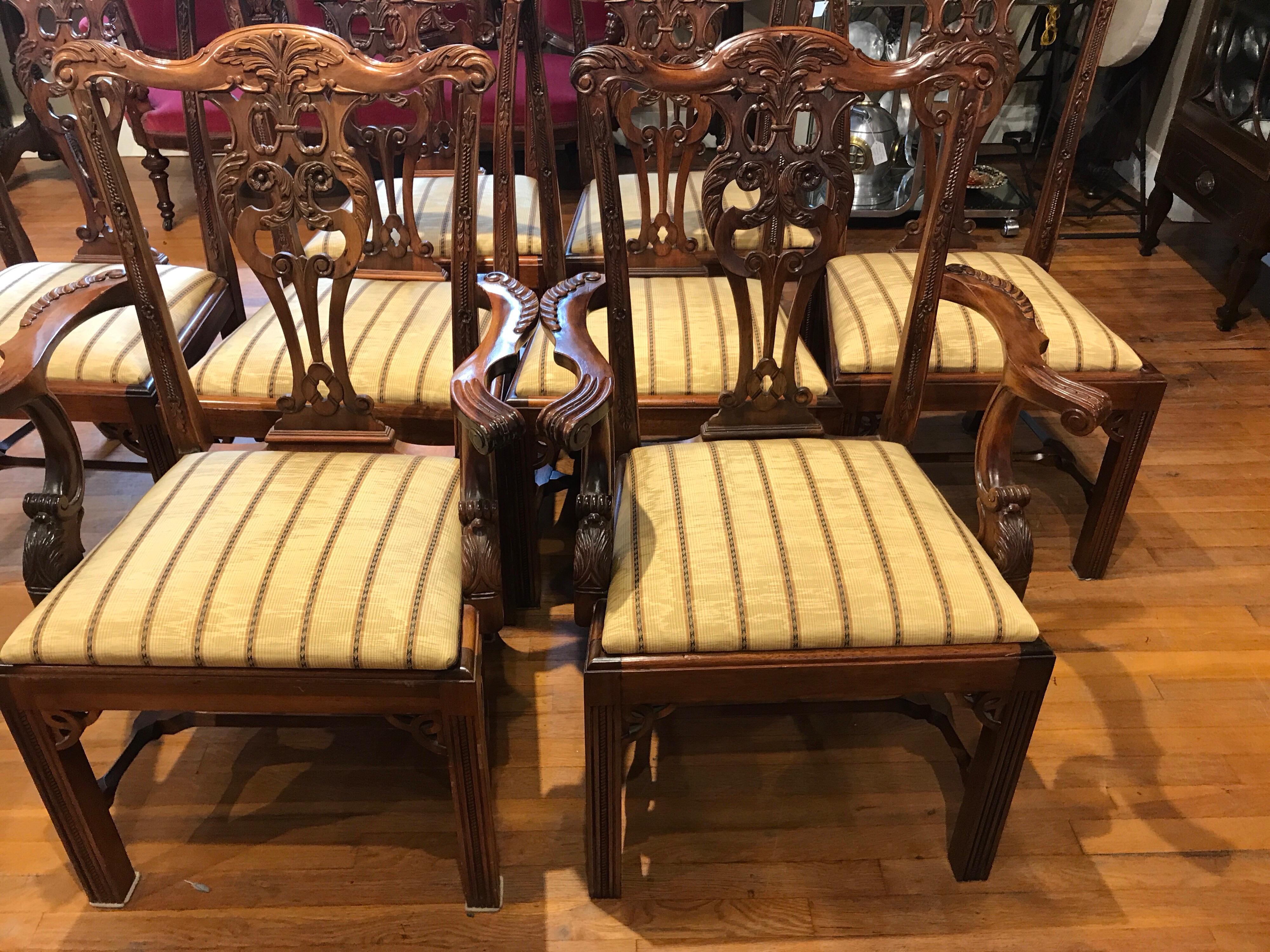Eight George III style Mahogany dining chairs, with finely carved rosette backrests, raised on reeded Marlborough legs.
The arm chairs measures: 40