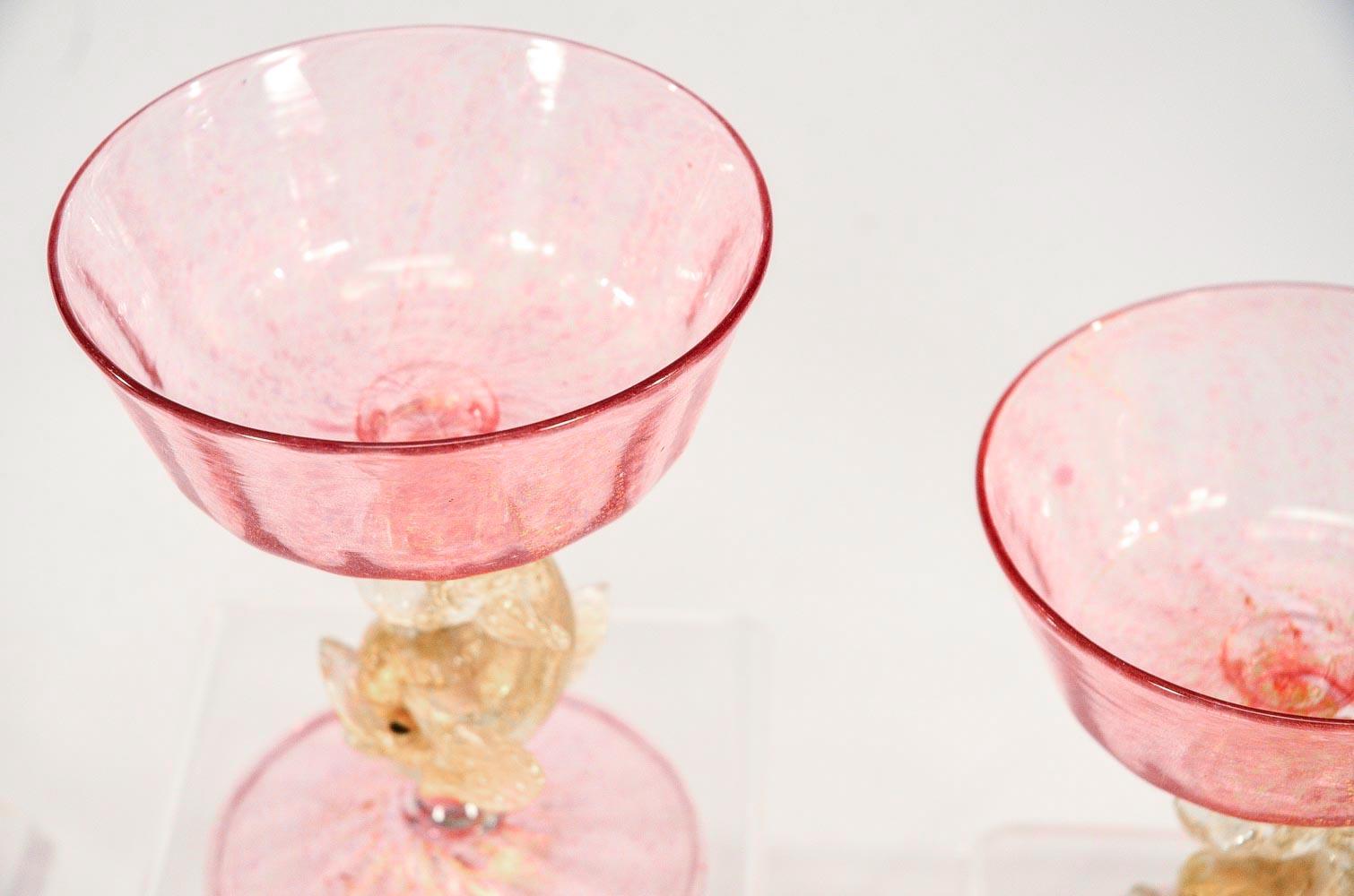 Early 20th Century Eight Handblown Venetian/Murano Pink Rose Champagne Coupes with Figural Dolphins