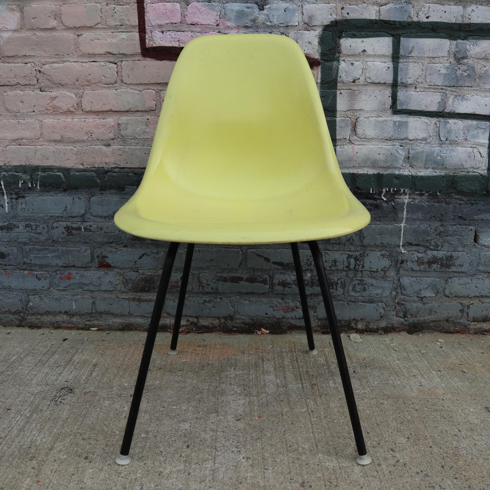 Eight Herman Miller Eames Multicolored Dining Chairs 1