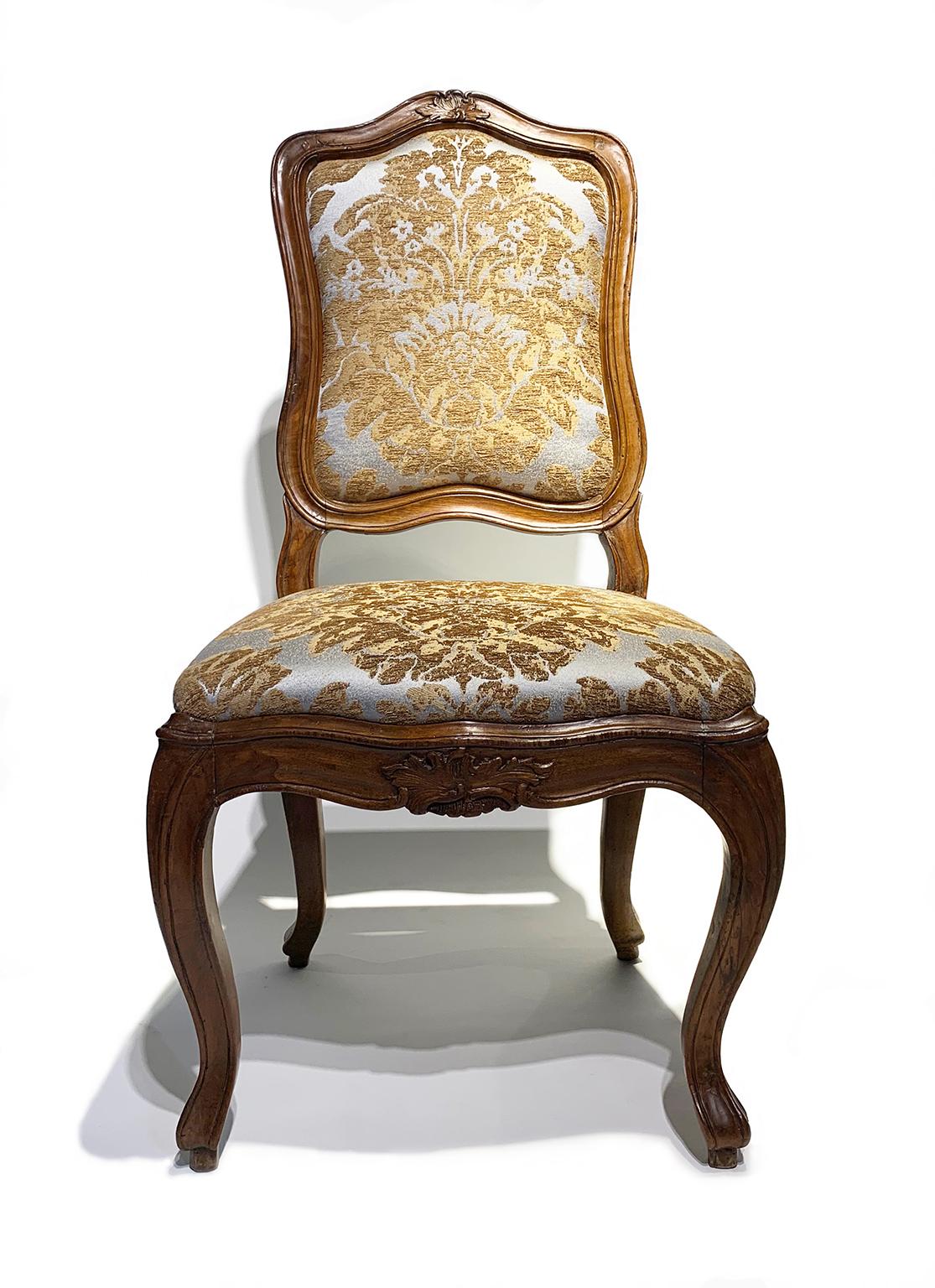 Rococo Eight Italian Chairs in Carved Walnut, Genoa, circa 1750