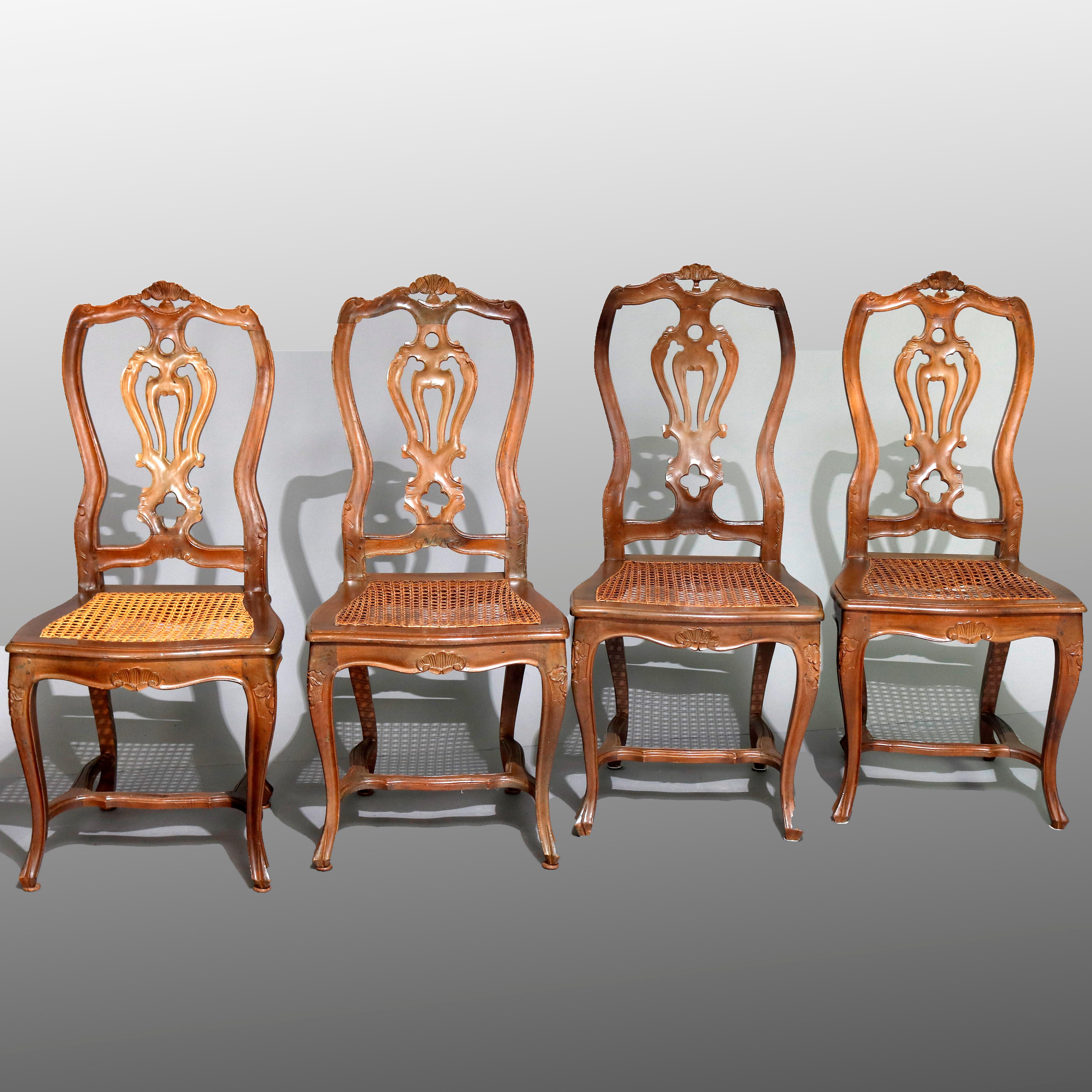 Eight Italian Renaissance Revival Carved Fruitwood and Caned Dining Chairs 4