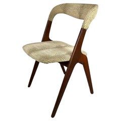 Eight Johannes Andersen Teak Dining Chairs