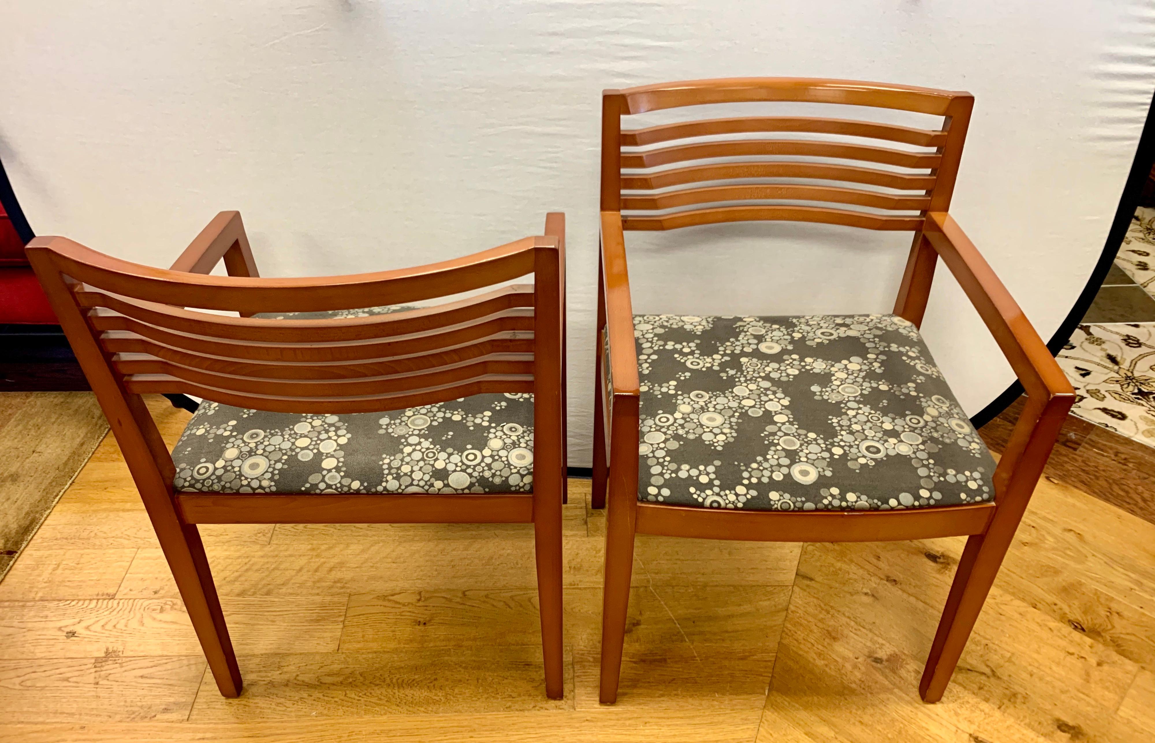 Set of eight Knoll Studio Ricchio armchairs designed by Joseph and Linda Ricchio in 1990. The chairs are done in a medium beechwood finish and have a gorgeous Knoll fabric on the seat which gives it an iconic midcentury look. The chairs retain the