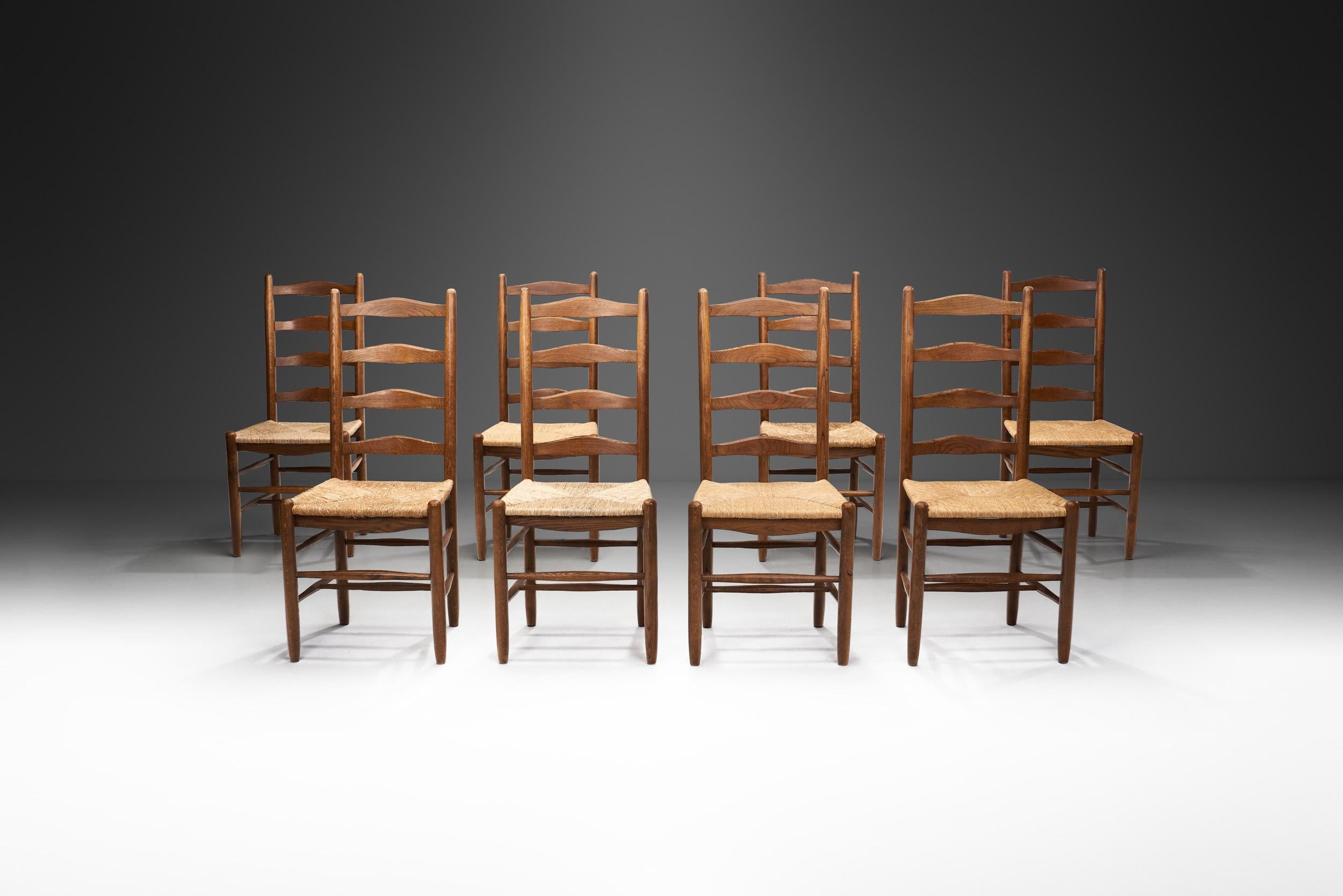 Mid-Century Modern Eight Ladderback Dining Chairs with Rush Seats, Europe late 20th century For Sale