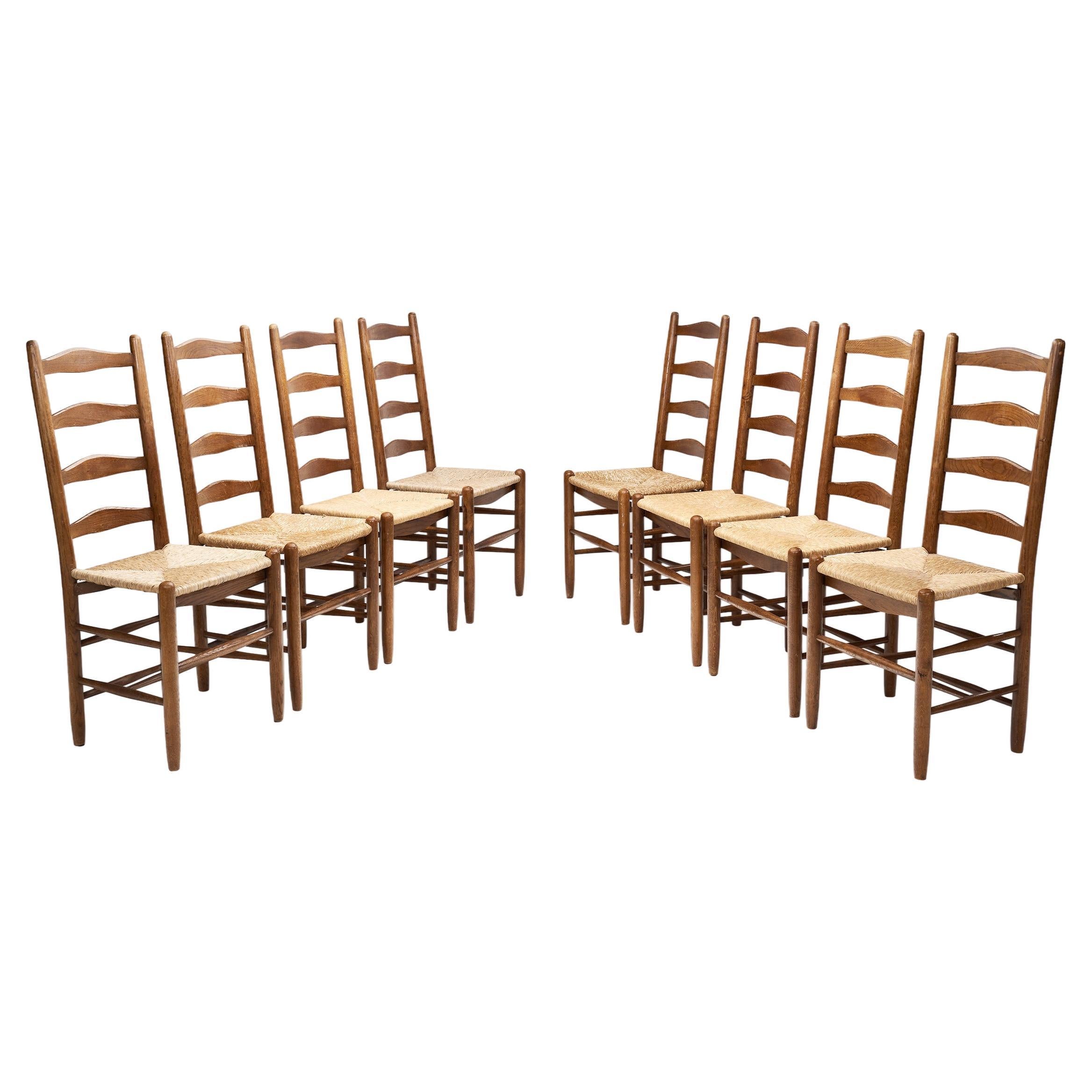 Eight Ladderback Dining Chairs with Rush Seats, Europe late 20th century For Sale