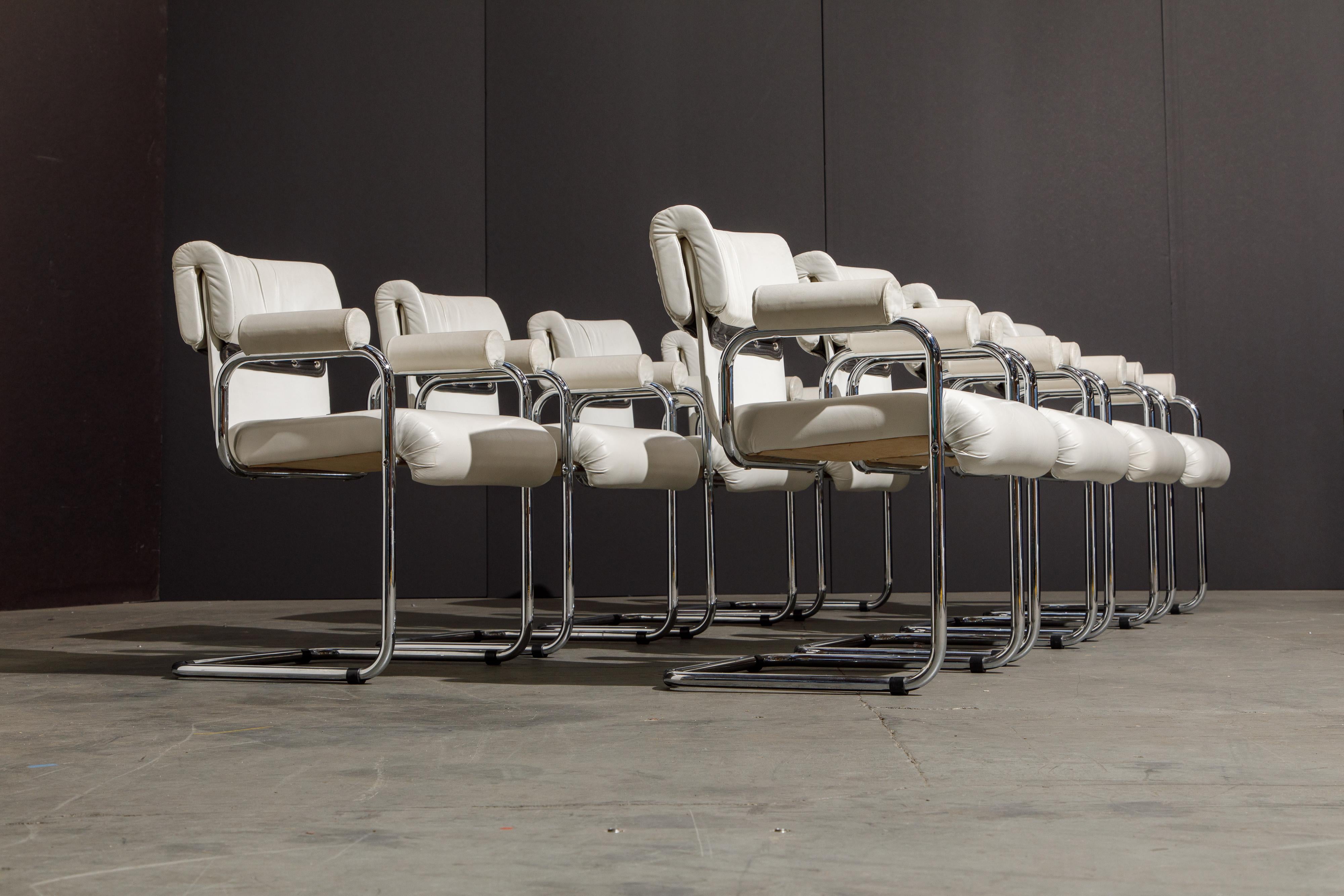 This handsome set of eight (8) armchairs were designed by Guido Faleschini for the Italian maker i4 Mariani, under The Pace Collection. The seats and backs retain the original supple white colored leather upholstery and are attached to graceful