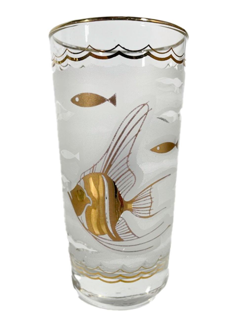 Eight Mid-Century Modern highball glasses by Libbey Glass, having a frosted water-patterned ground with large angel fish and small stylized fish in 22k gold on front and back, the sides decorated with seahorses in white enamel.