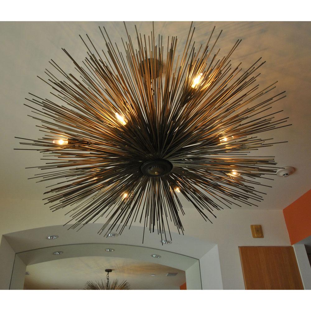 Jean De Merry

Eight-light Lumière chandelier by Jean De Merry Design 



Lumière chandelier designed by Jean De Merry. Reminiscent of a sea urchin in a metallic finish with eight arms and lights. 

Hangs from a stem to chain suspension, and