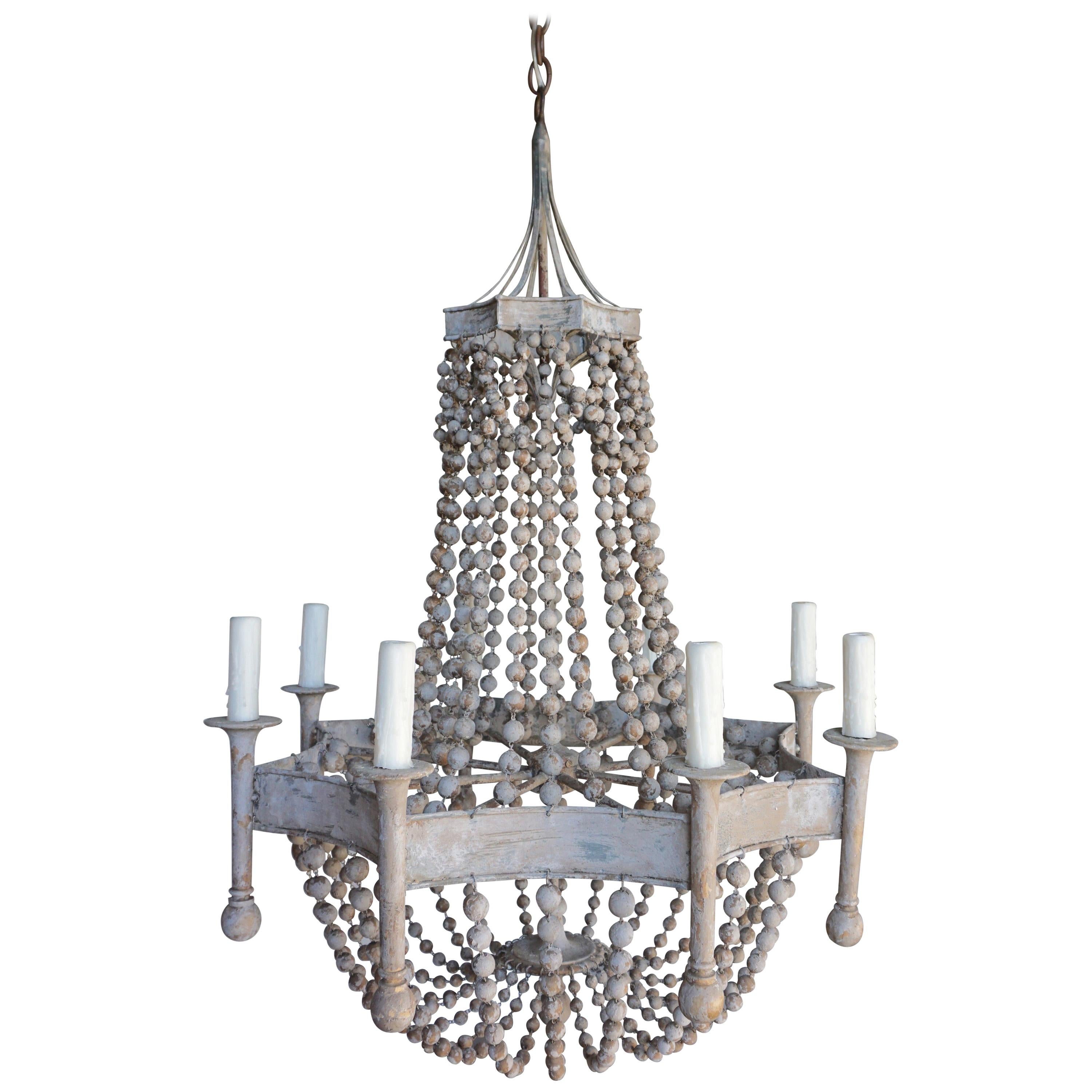 Eight Light Painted Wood Beaded Chandelier