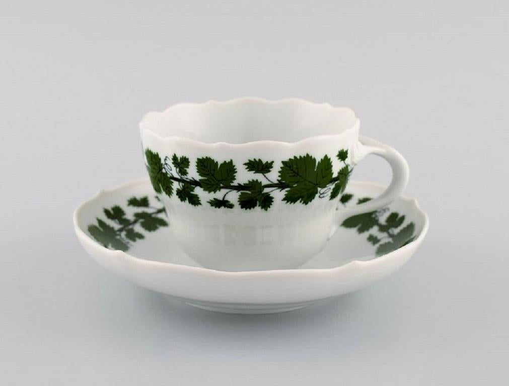 Eight Meissen Green Ivy Vine coffee cups with saucers in hand-painted porcelain. 1940's.
The cup measures: 8.8 x 6.8 cm.
Saucer diameter: 14.5 cm.
In excellent condition.
Stamped.
3rd Factory quality.
 