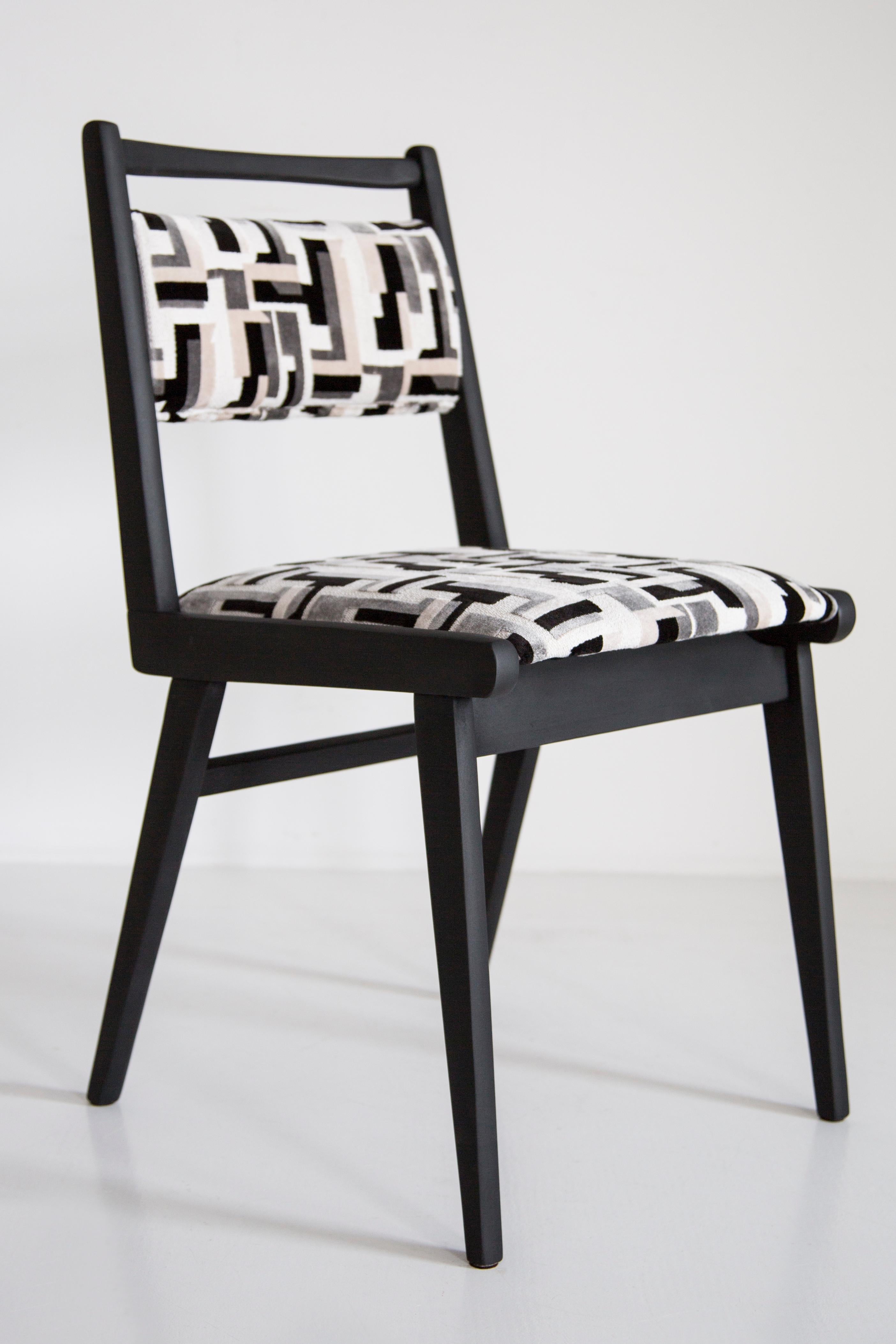 Chairs designed in 1960s by Prof. Rajmund Halas. It is jar type model. 
Made of beechwood. Chairs are after a complete upholstery renovation, the woodwork has been refreshed and painted in matte black. Seat and back is dressed in a black and white