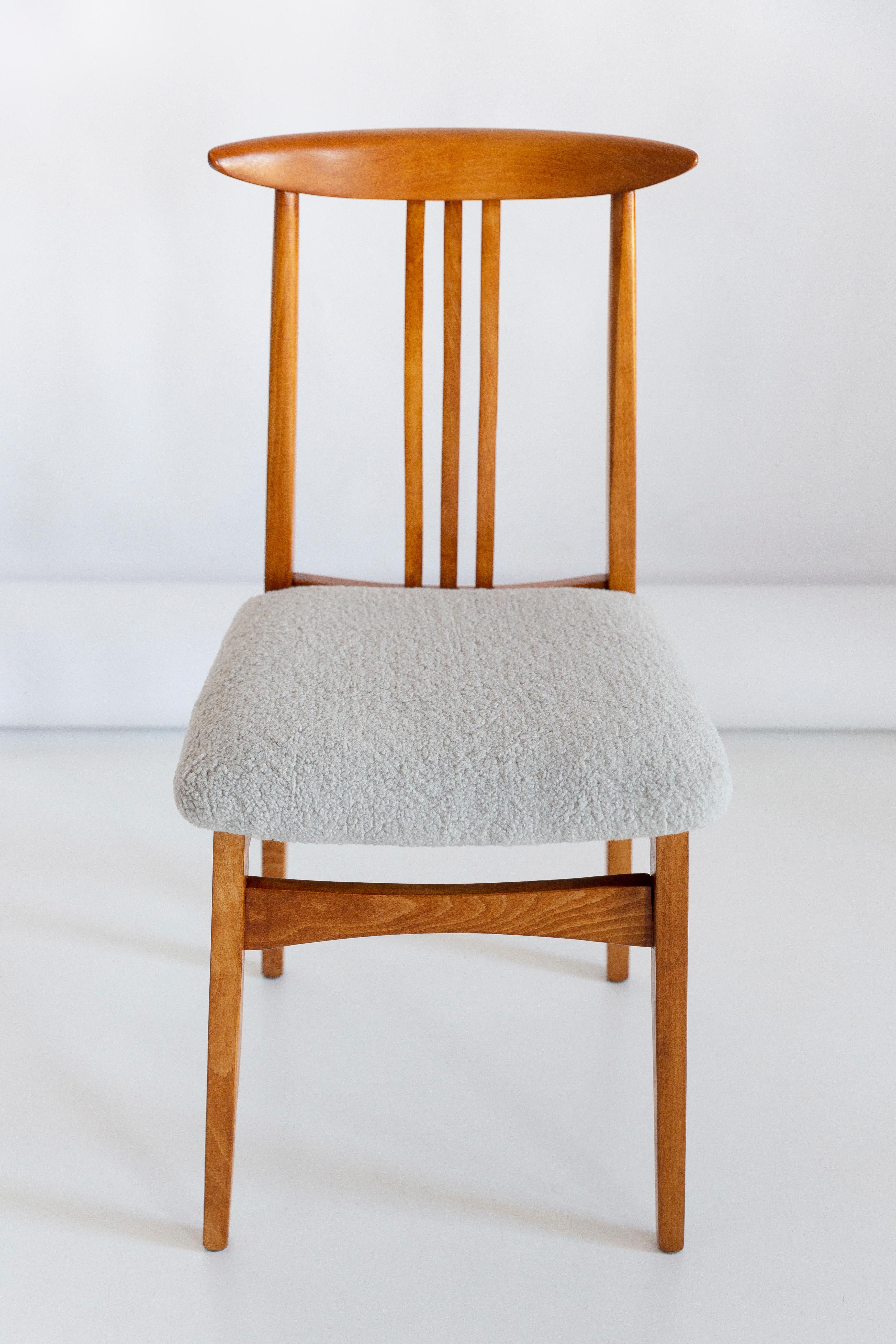 A beautiful beech chair designed by M. Zielinski, type 200 / 100B. Manufactured by the Opole Furniture Industry Center at the end of the 1960s in Poland. The chair is after undergone a complete carpentry and upholstery renovation. Seats covered with