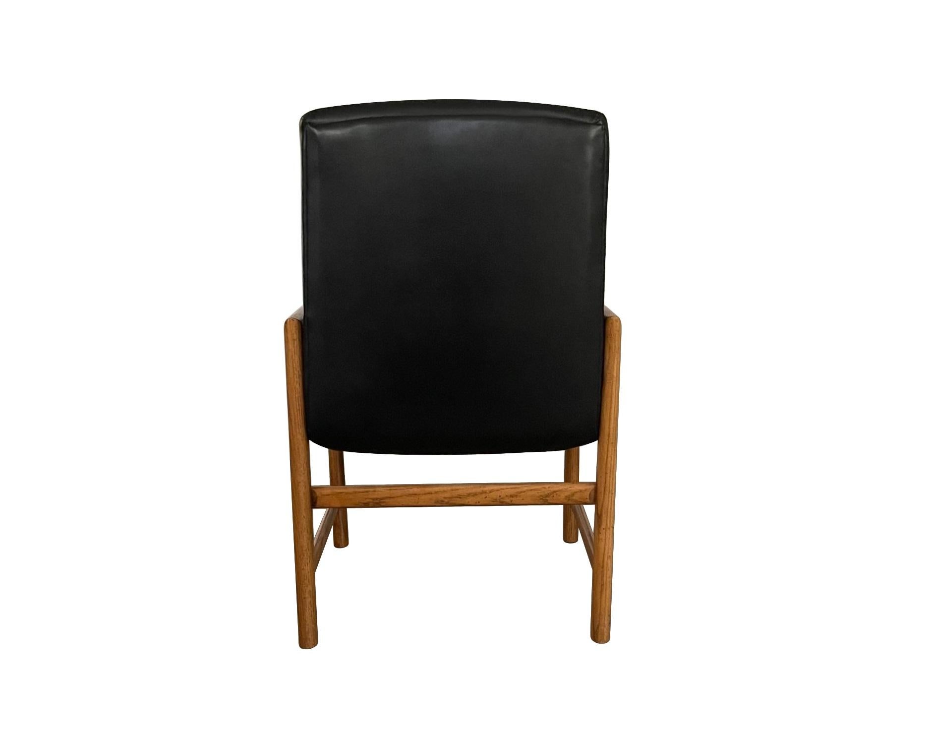 Eight Mid-Century Modern Black Leather Dining Armchairs For Sale 9