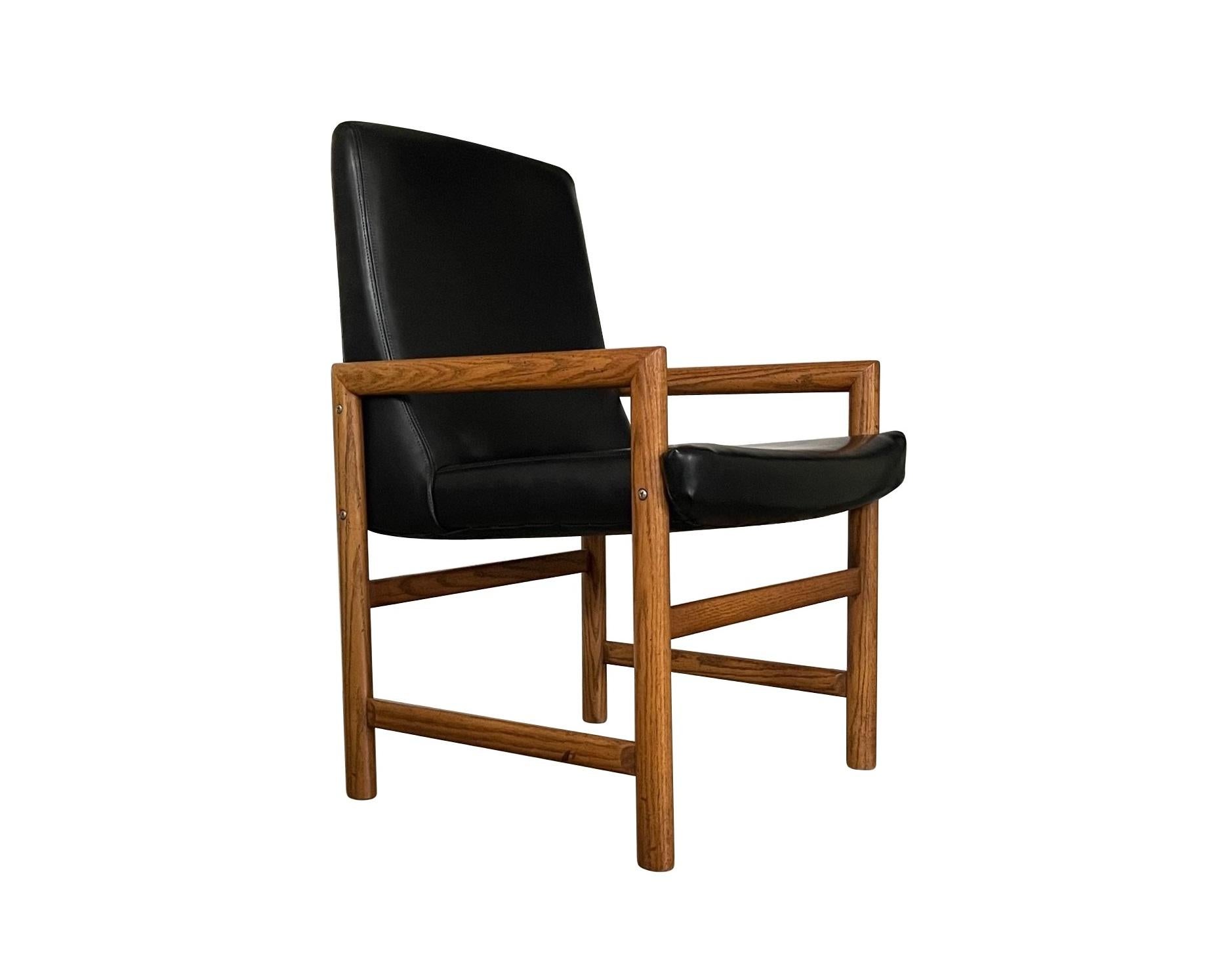 20th Century Eight Mid-Century Modern Black Leather Dining Armchairs For Sale