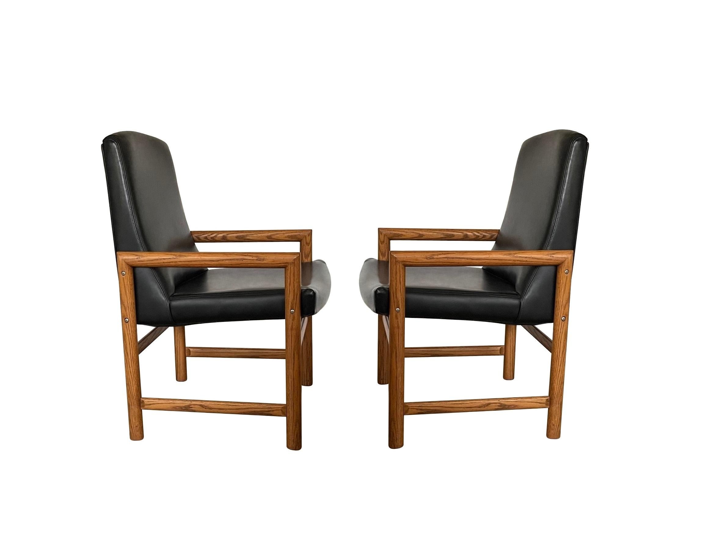 Eight Mid-Century Modern Black Leather Dining Armchairs For Sale 1