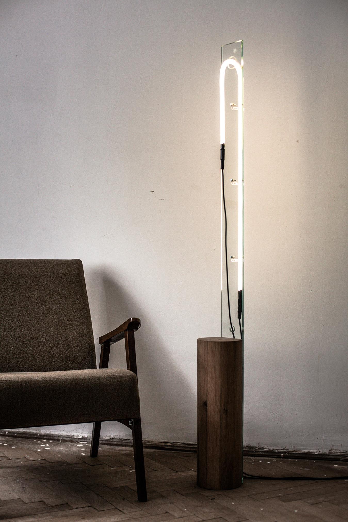 “Eight minutes old” is a family of sculptured objects and light installations. They’re part of a small series of two compositions and are made in a composition of wood and glass, using the light tube as a central element. The base of the lamp is a