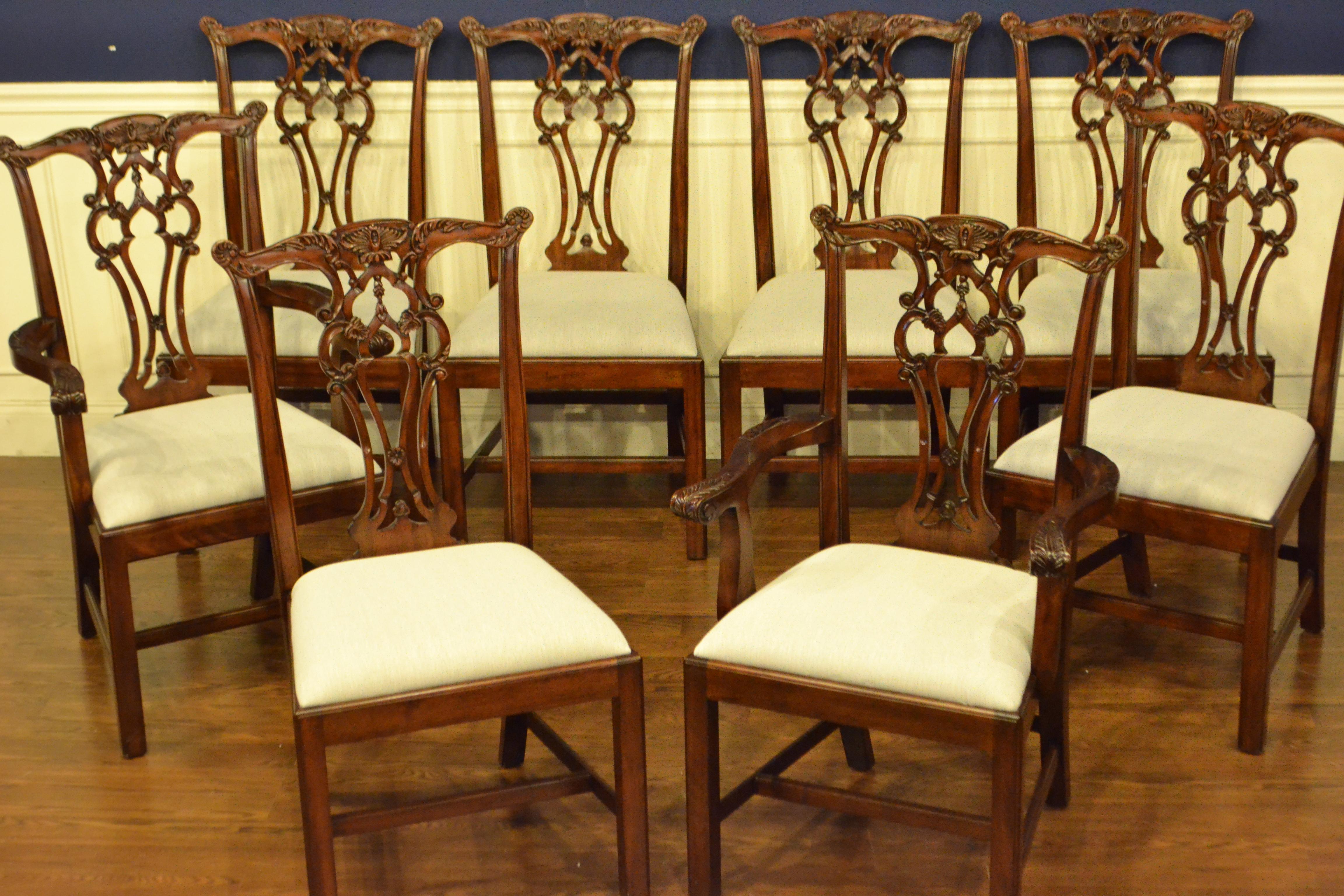 These are new traditional mahogany dining chairs. Their design was inspired by the Chippendale style straight leg dining chairs from the Georgian period. They feature Classic straight leg Chippendale legs and intricately carved backs. This is a set